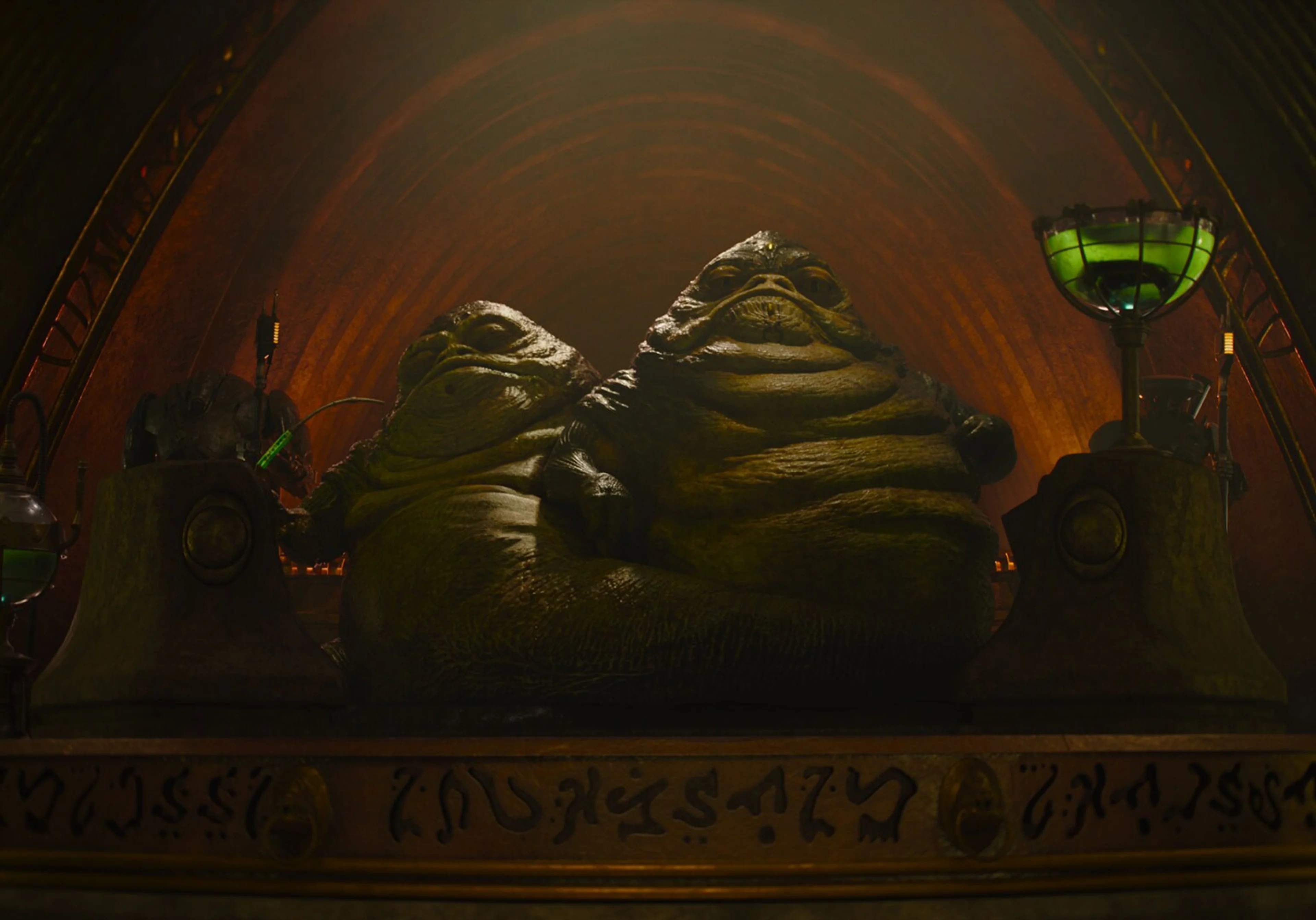 The two Hutt crime bosses sit together in a large room.