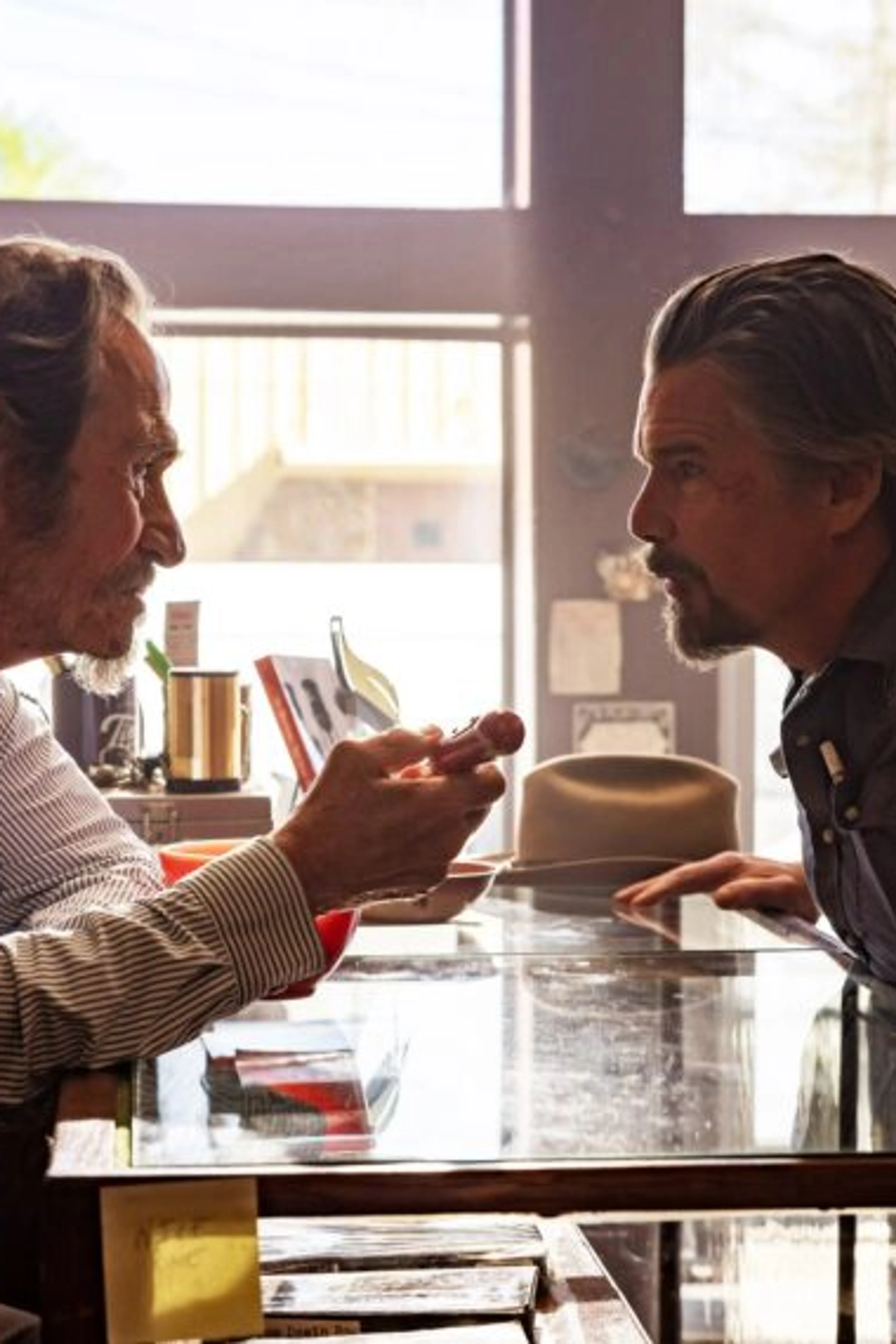 Tommy Lee Jones and Ethan Hawke face each other across Lee’s bookshop counter.
