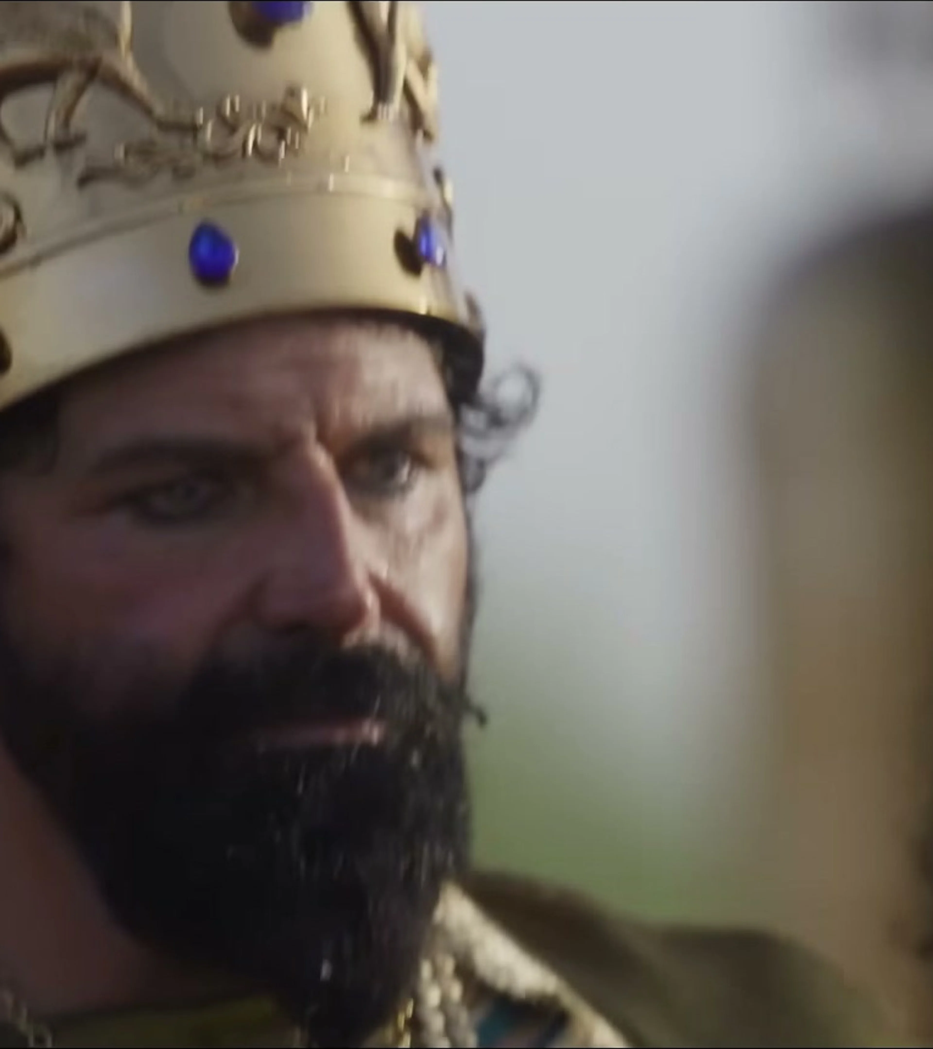 Elijah Alexander appears in a sharp close-up as King Nebuchadnezzar.