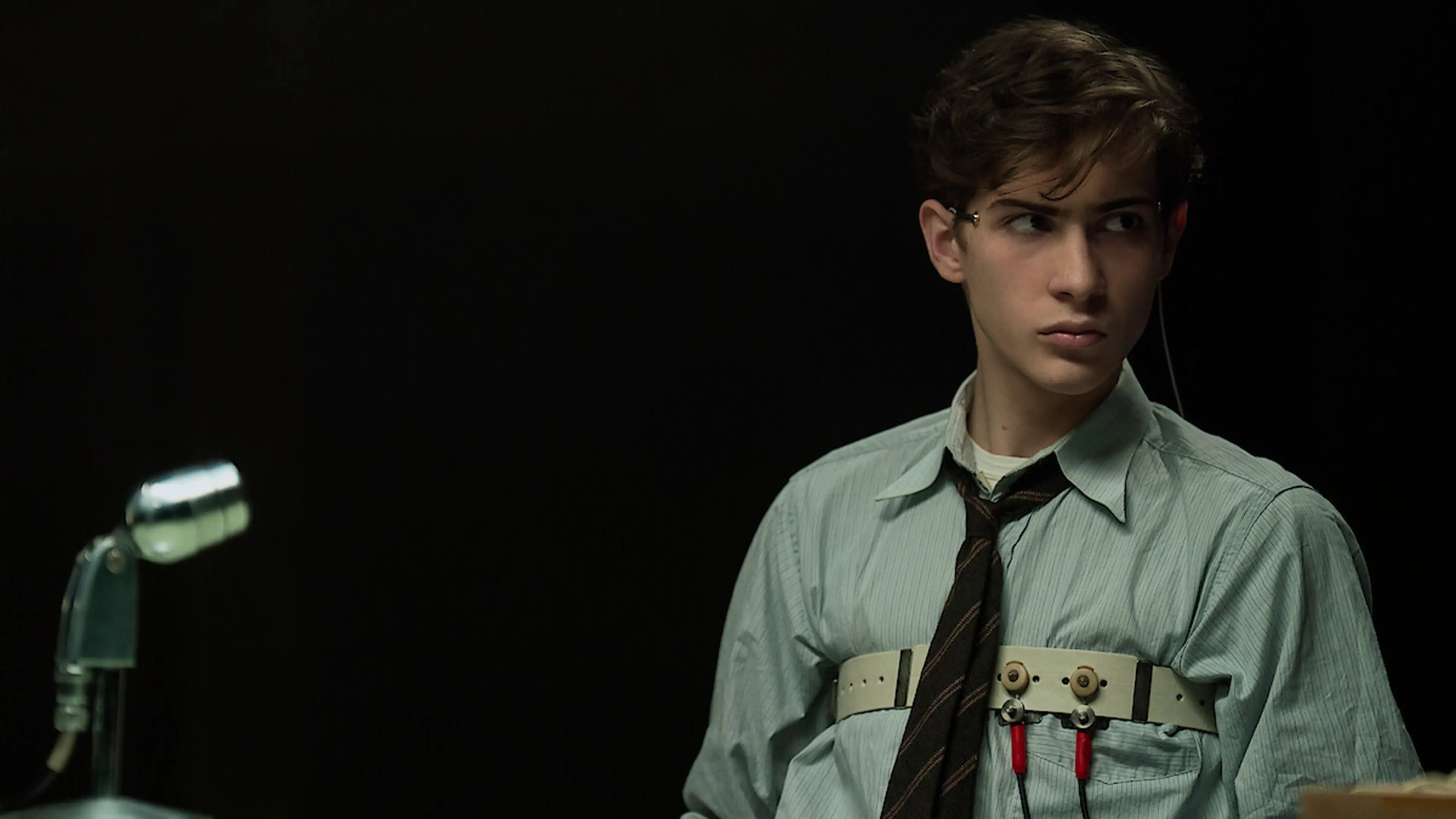 Jacob Tremblay as young Ted Kaczynski wears polygraph equipment in UNABOMBER.