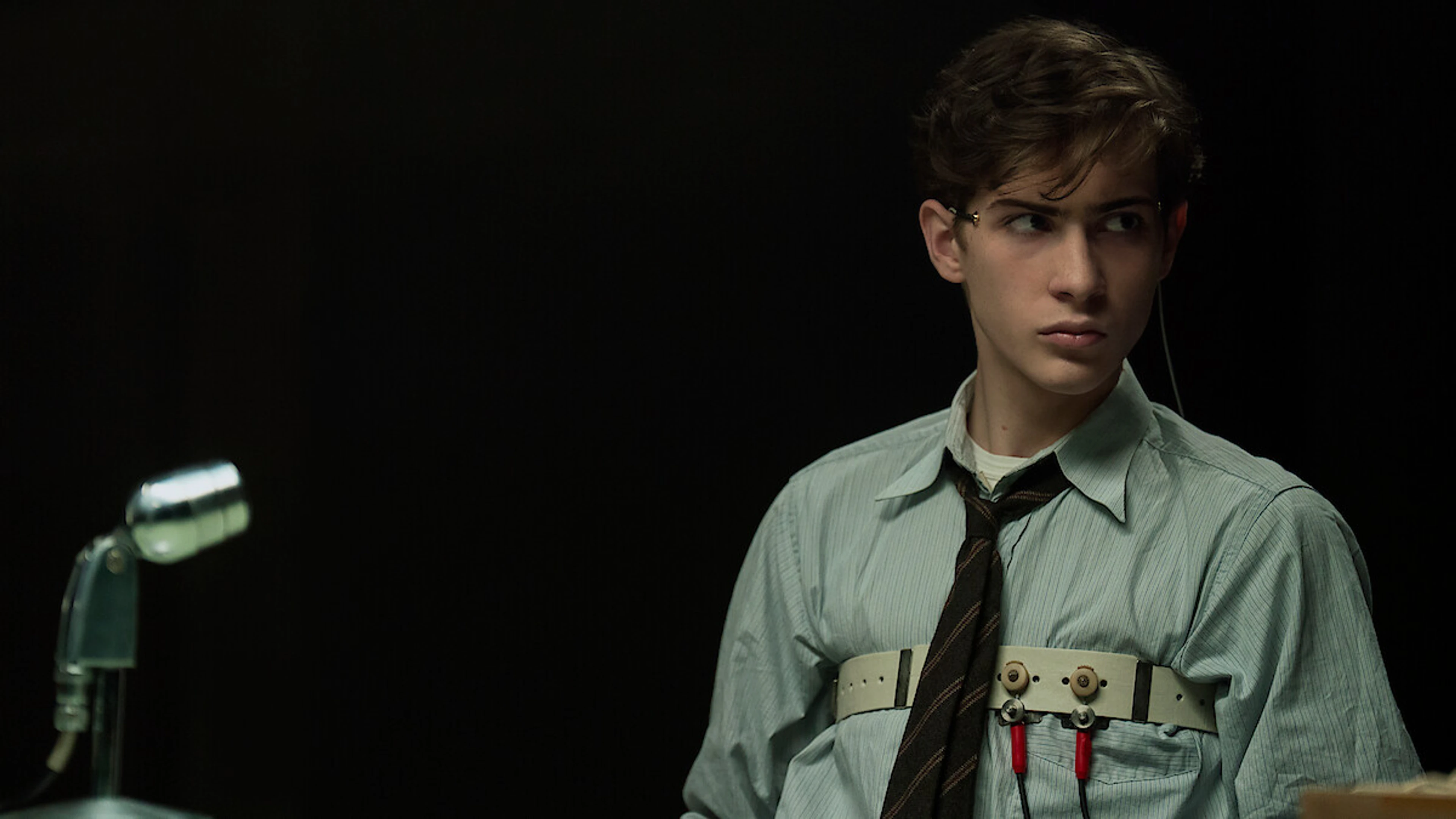 Jacob Tremblay as young Ted Kaczynski wears polygraph equipment in UNABOMBER.