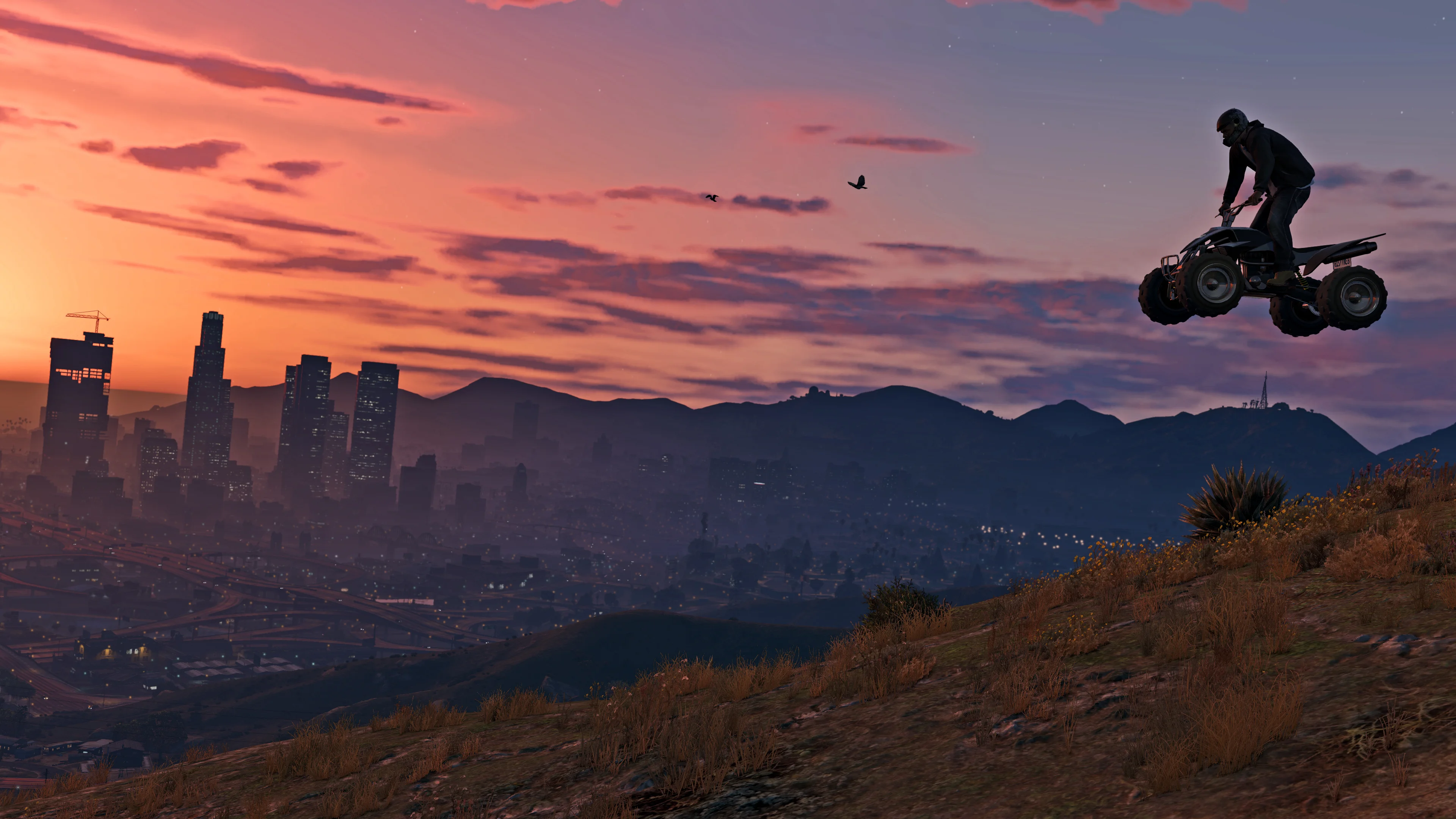 A rider crossing rough ground on an off-road vehicle in GTA 5.