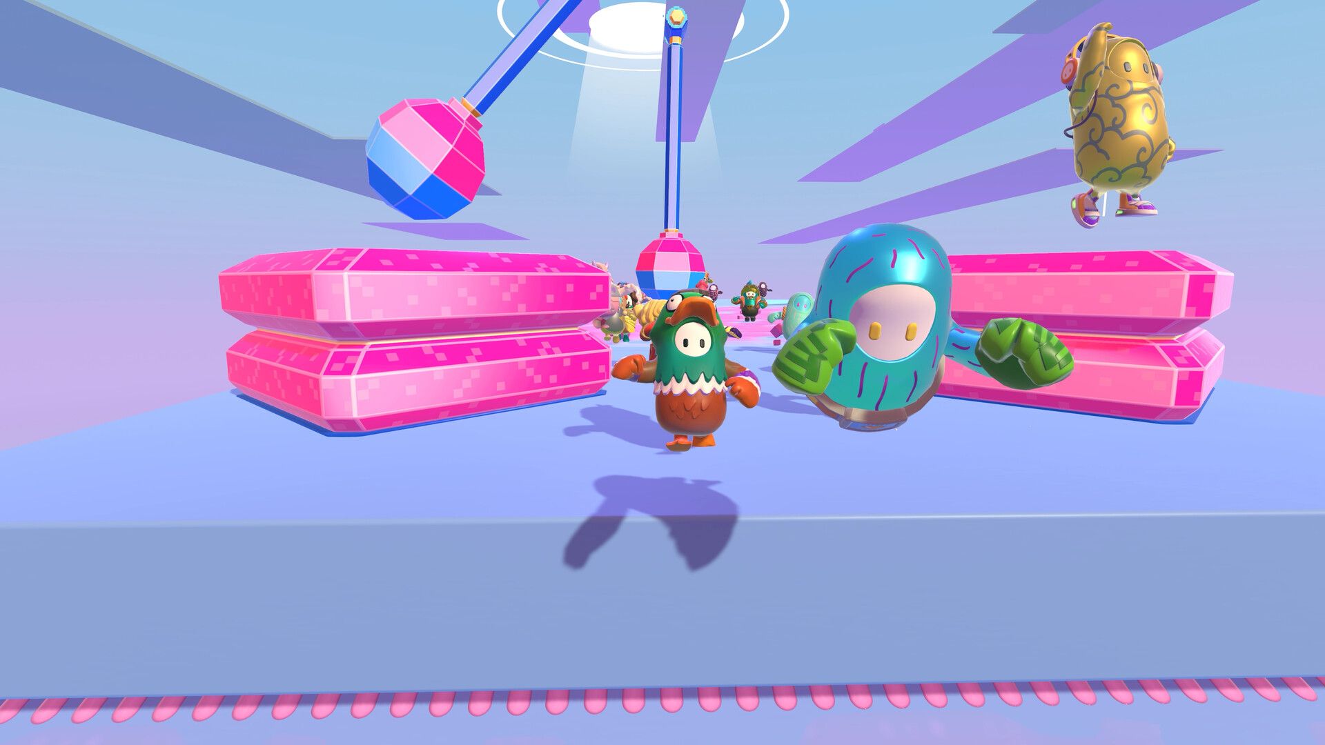 Two bean-shaped contestants leap between pink platforms and swinging obstacles.