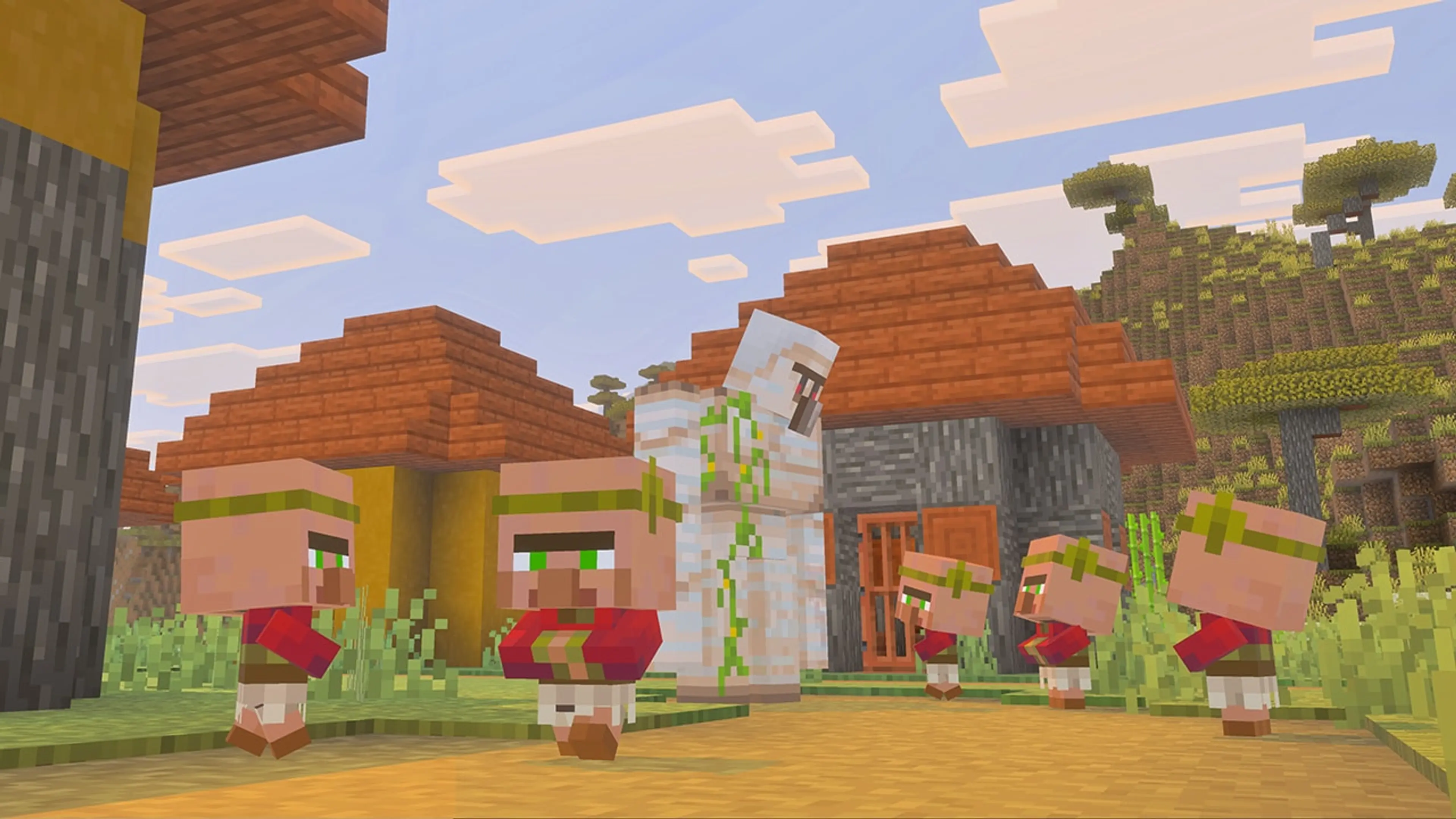 An iron golem standing with baby villagers in a Minecraft village.