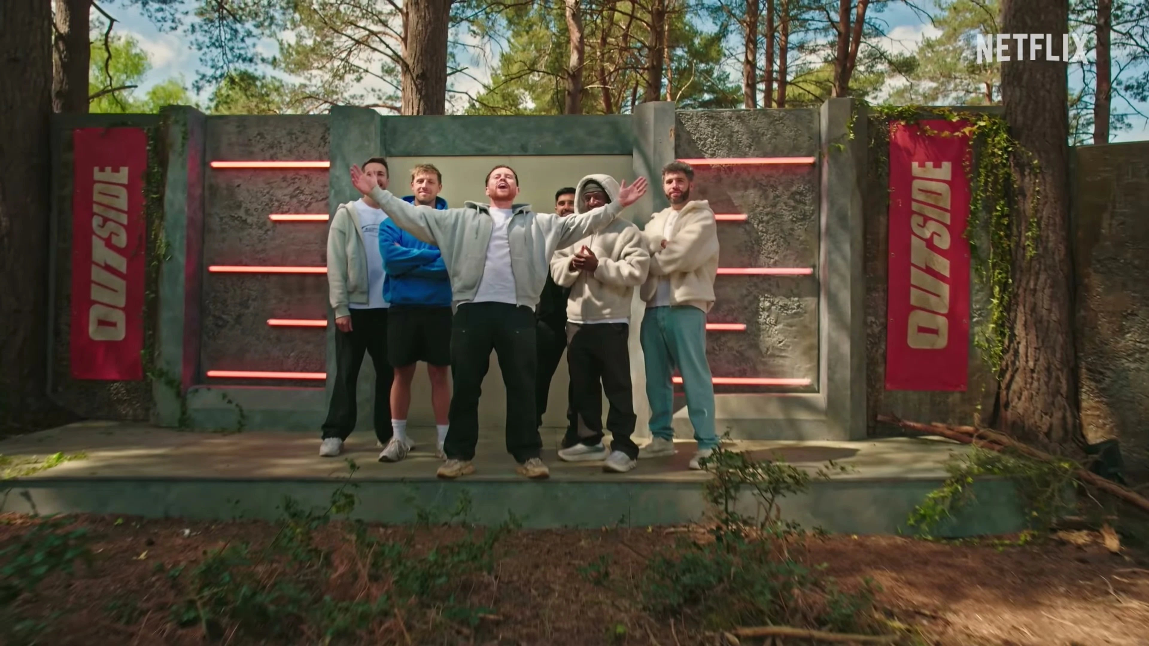 The Sidemen stand in front of the Outside set in an official Netflix trailer frame.