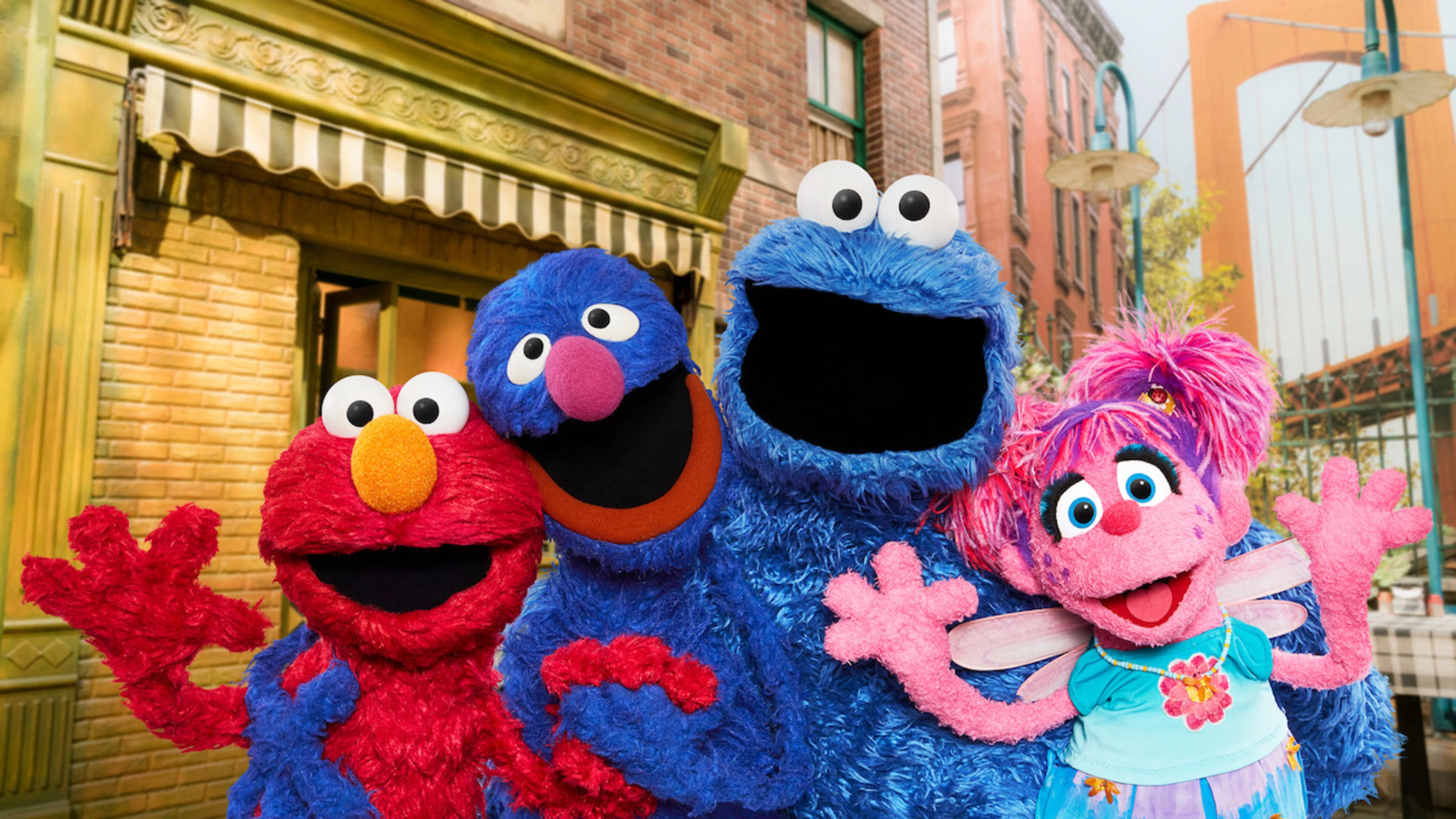 Elmo, Grover, Cookie Monster and Abby together on Sesame Street.