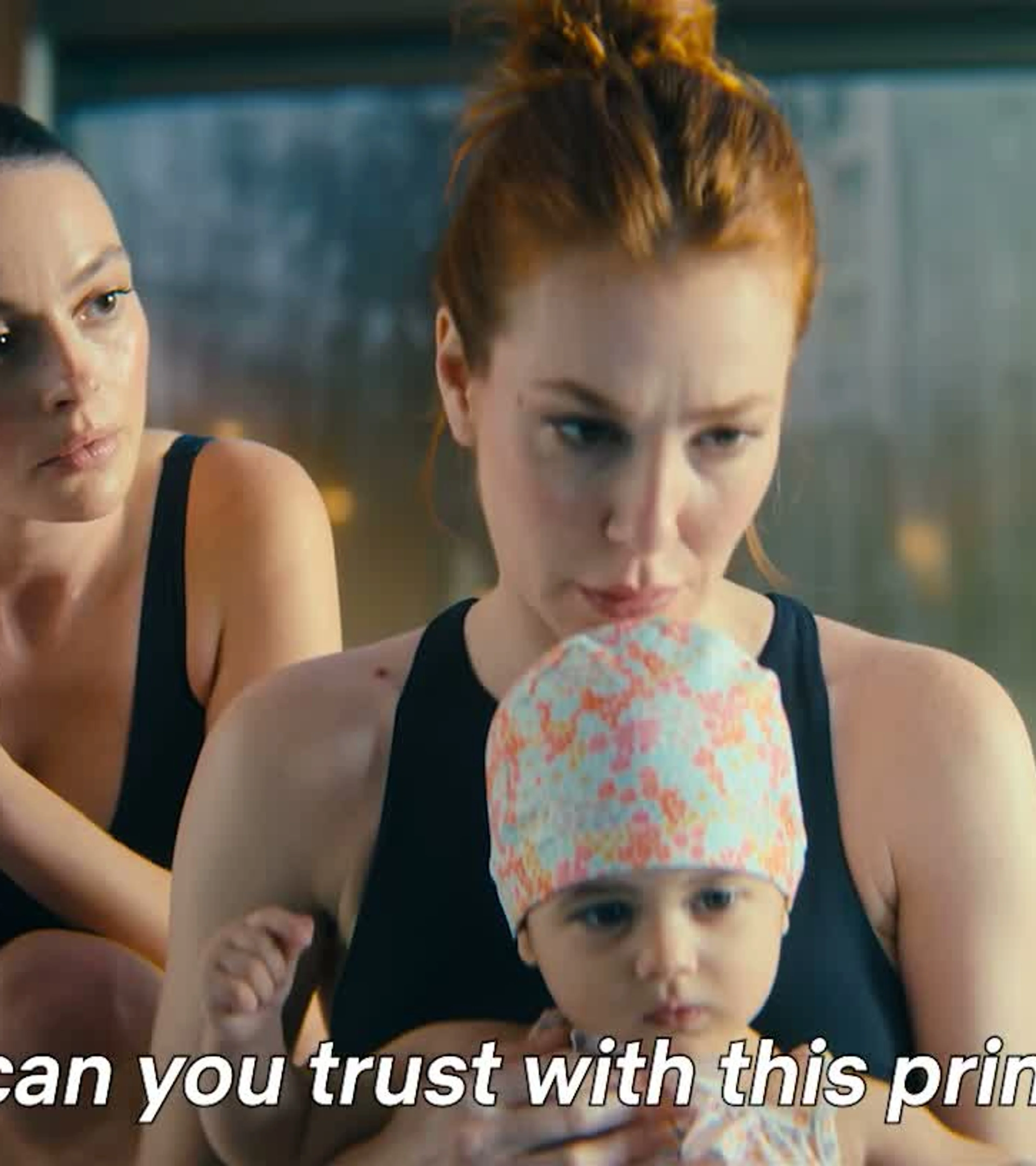 Funda, a nanny and a small child stand together by a pool in Not a Stranger.