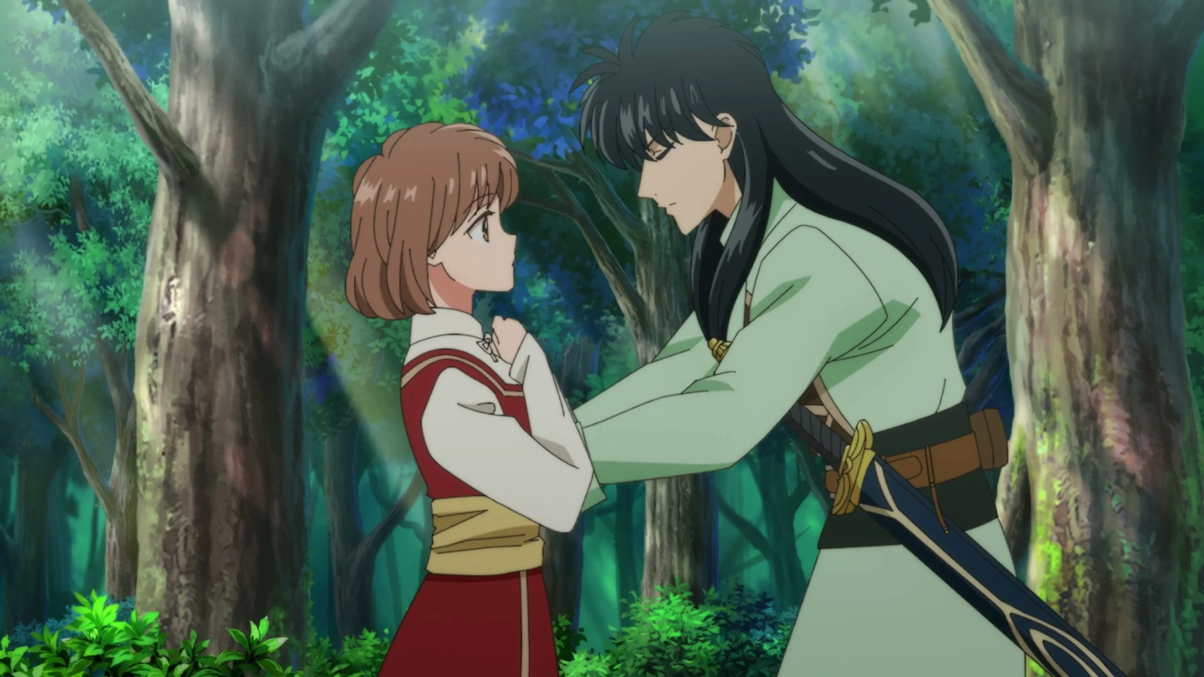 Noriko and Izark face each other in a green forest in the From Far Away anime trailer.