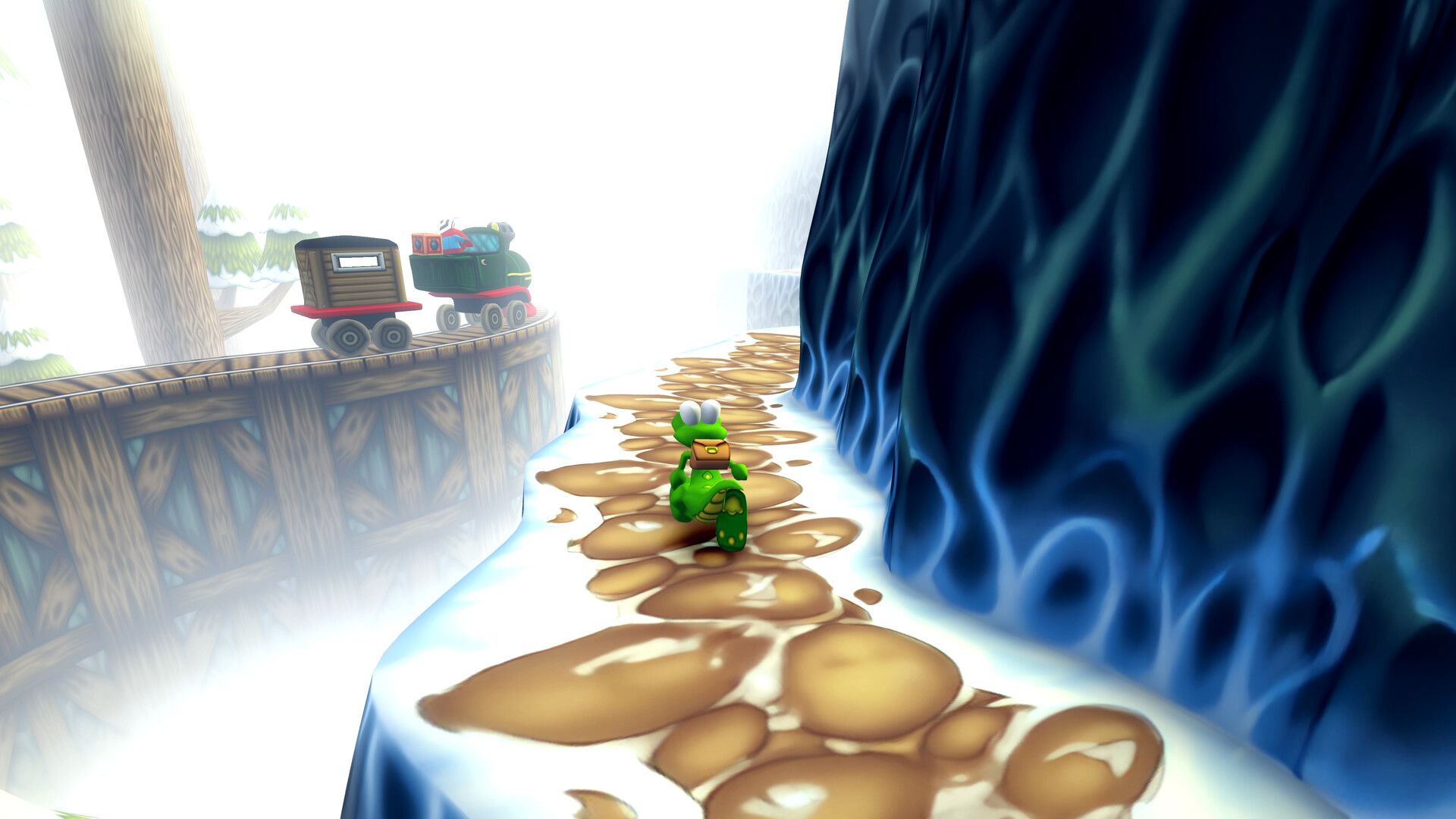 Croc explores a snowy path beside a wooden building in Croc 2.