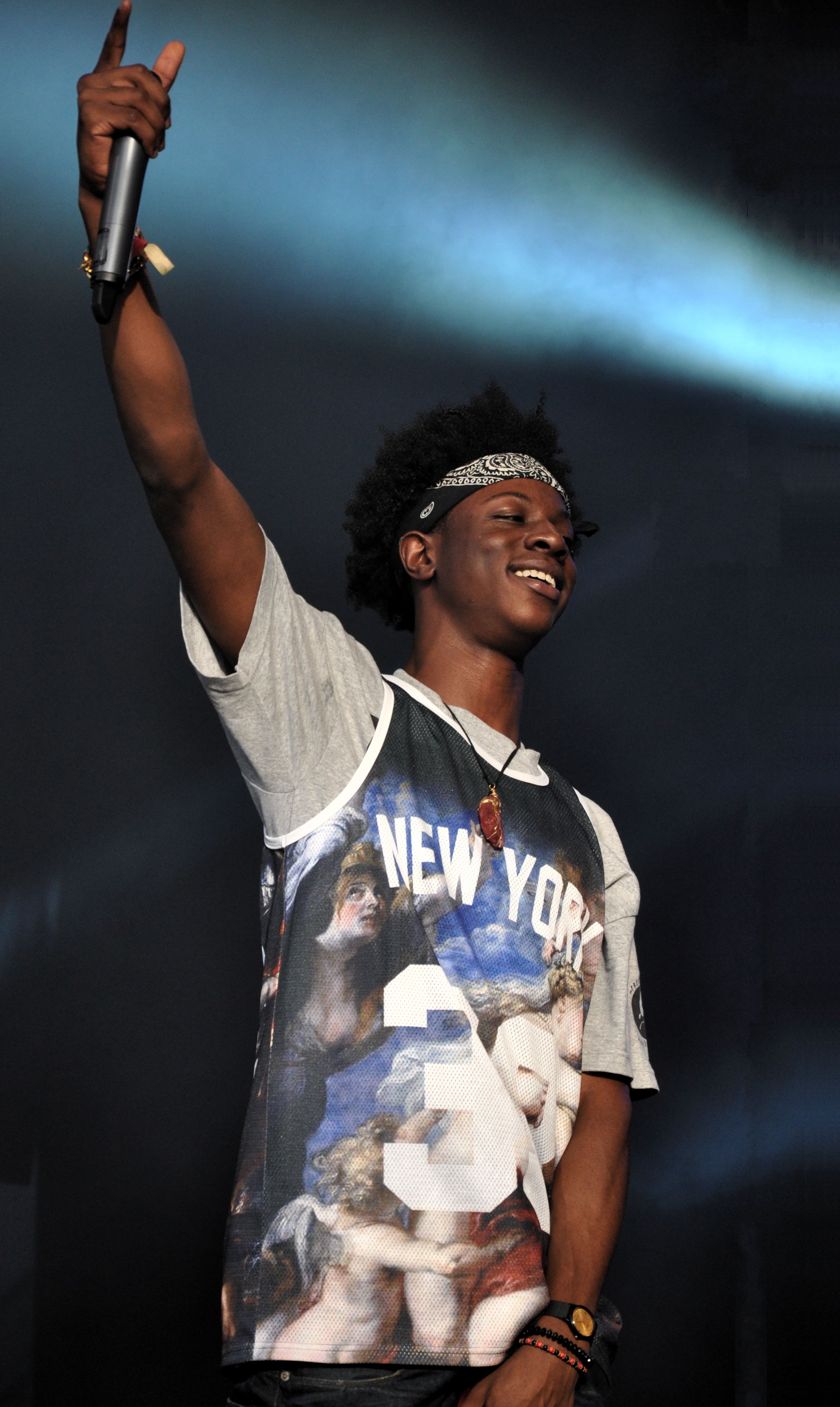 Joey Bada$$ smiles while performing at a 2013 festival.