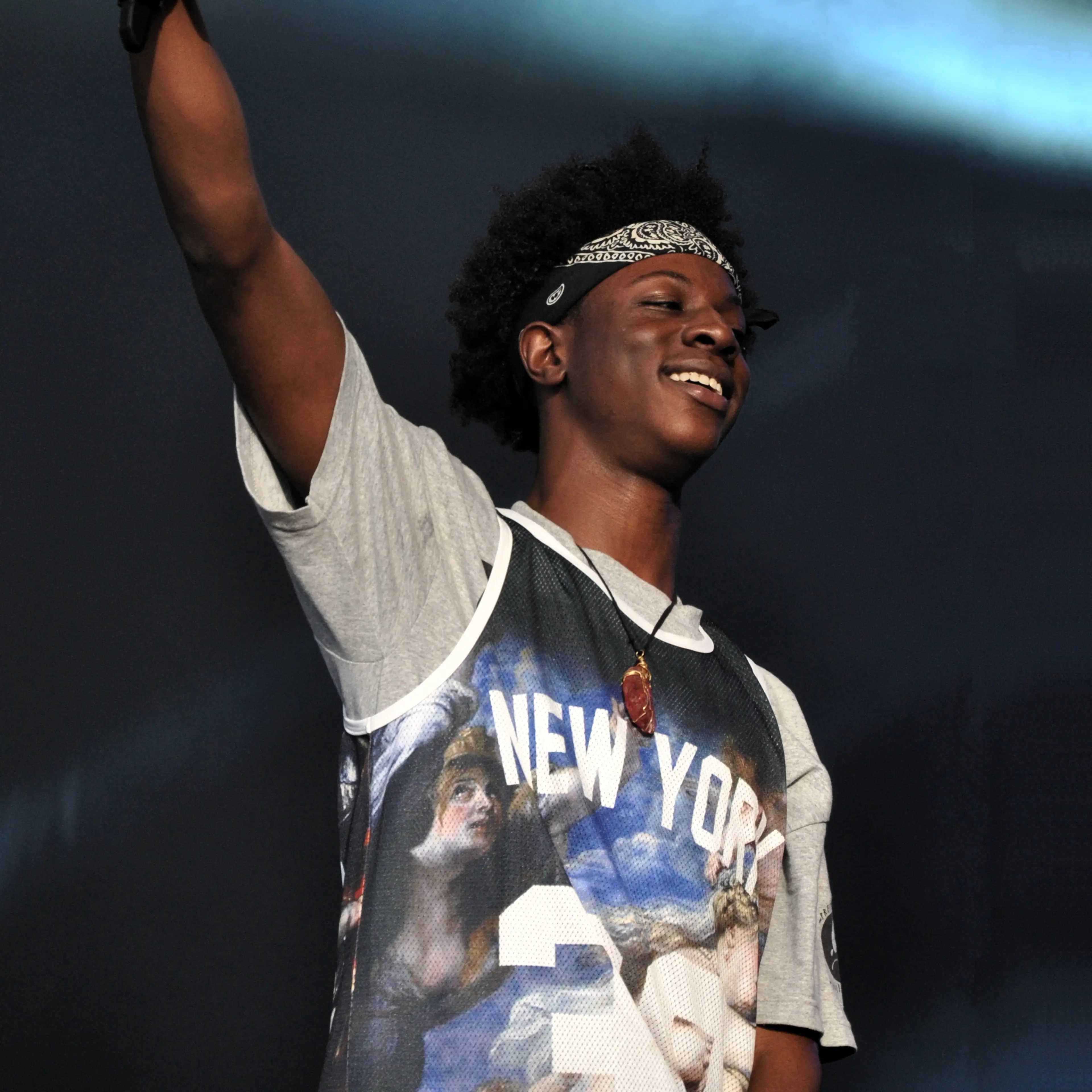 Joey Bada$$ smiles while performing at a 2013 festival.