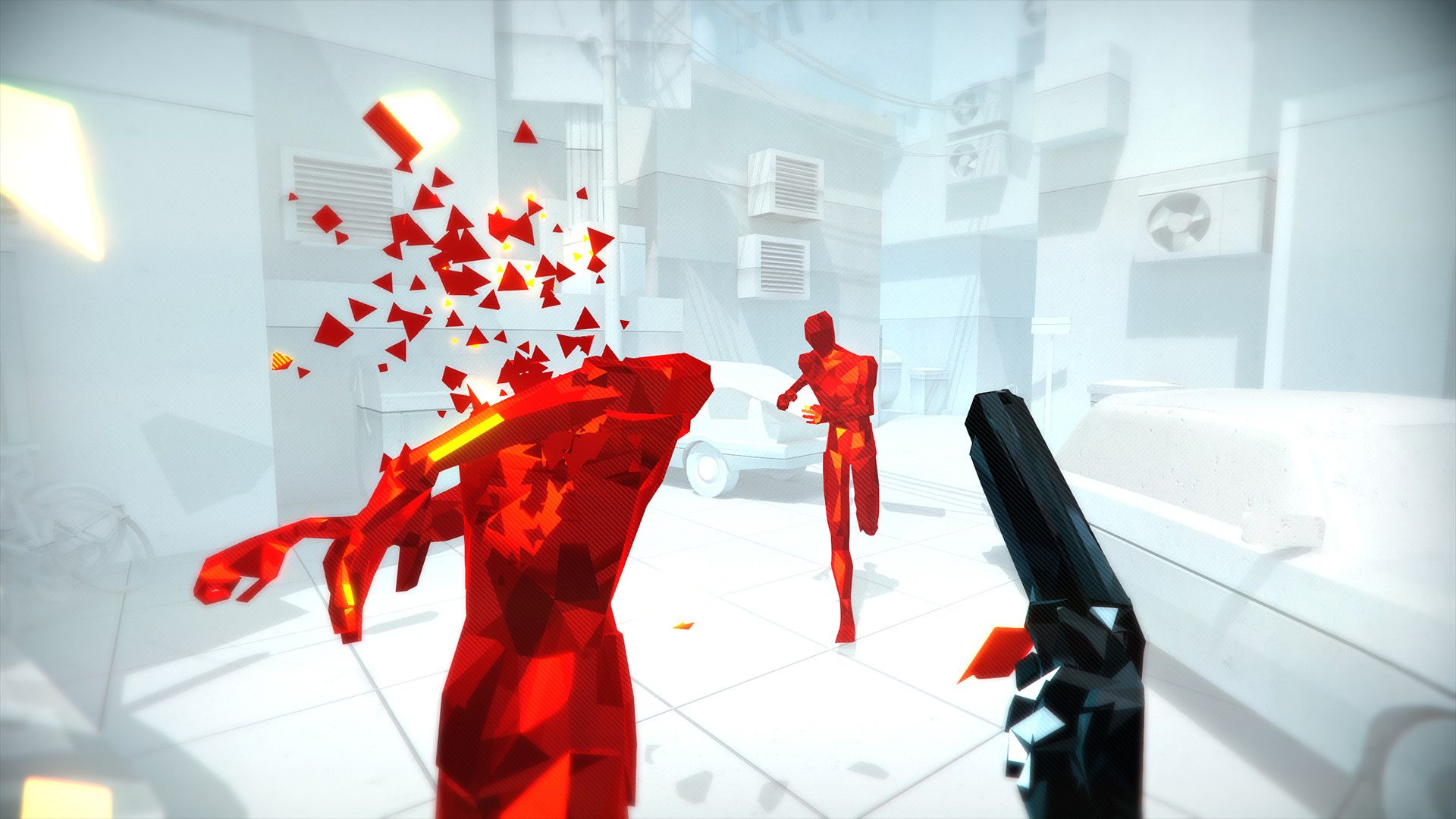 A black pistol points toward red figures breaking into shards in a white room.