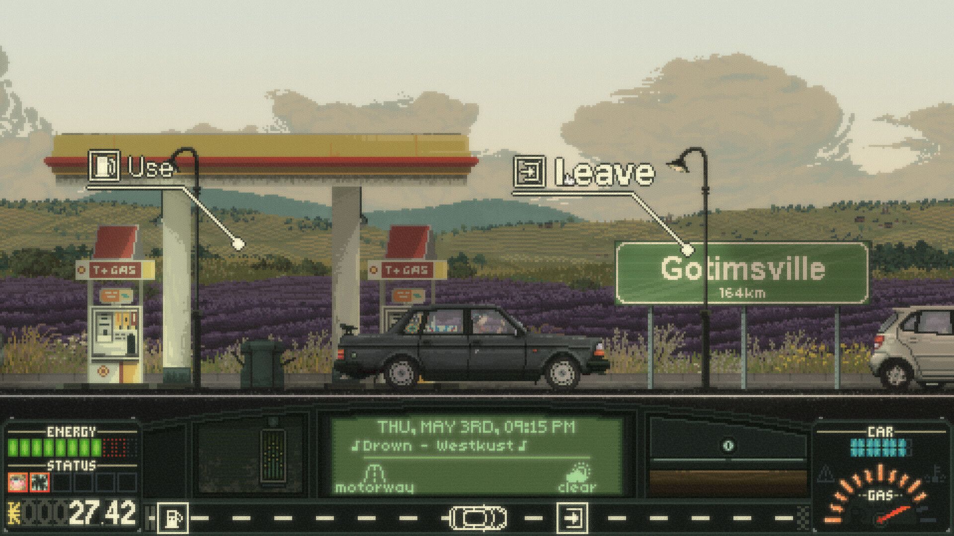A car waits at a roadside gas station.