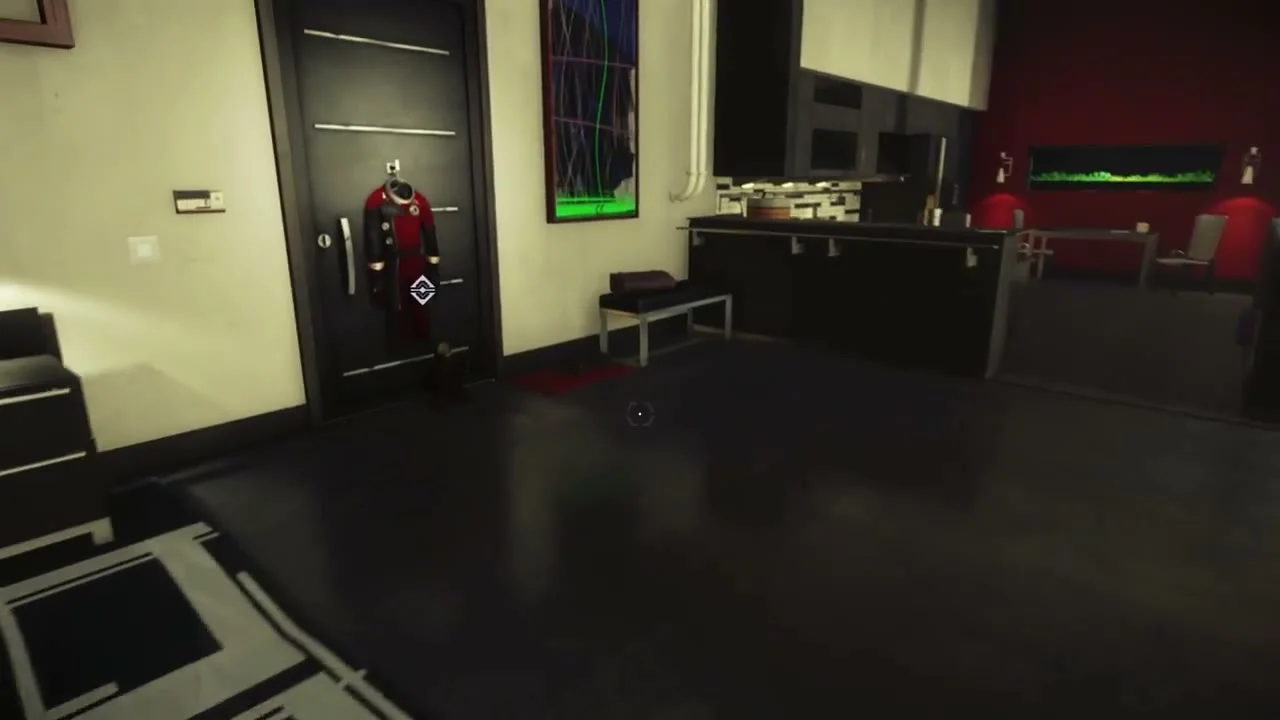 Morgan’s apartment with the red TranStar suit hanging on the dark door at left.
