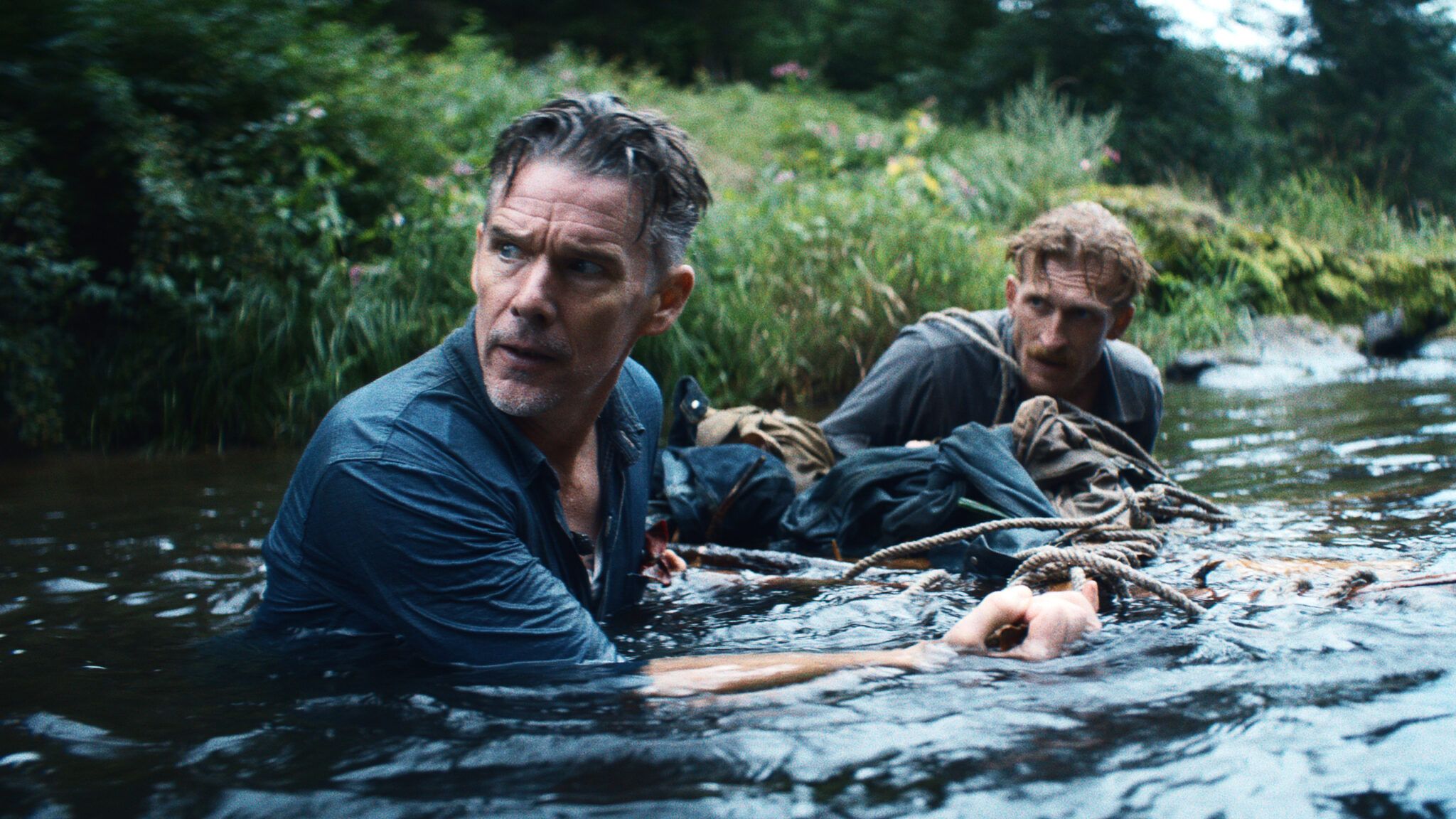 Ethan Hawke looks across a river in a scene from The Weight.