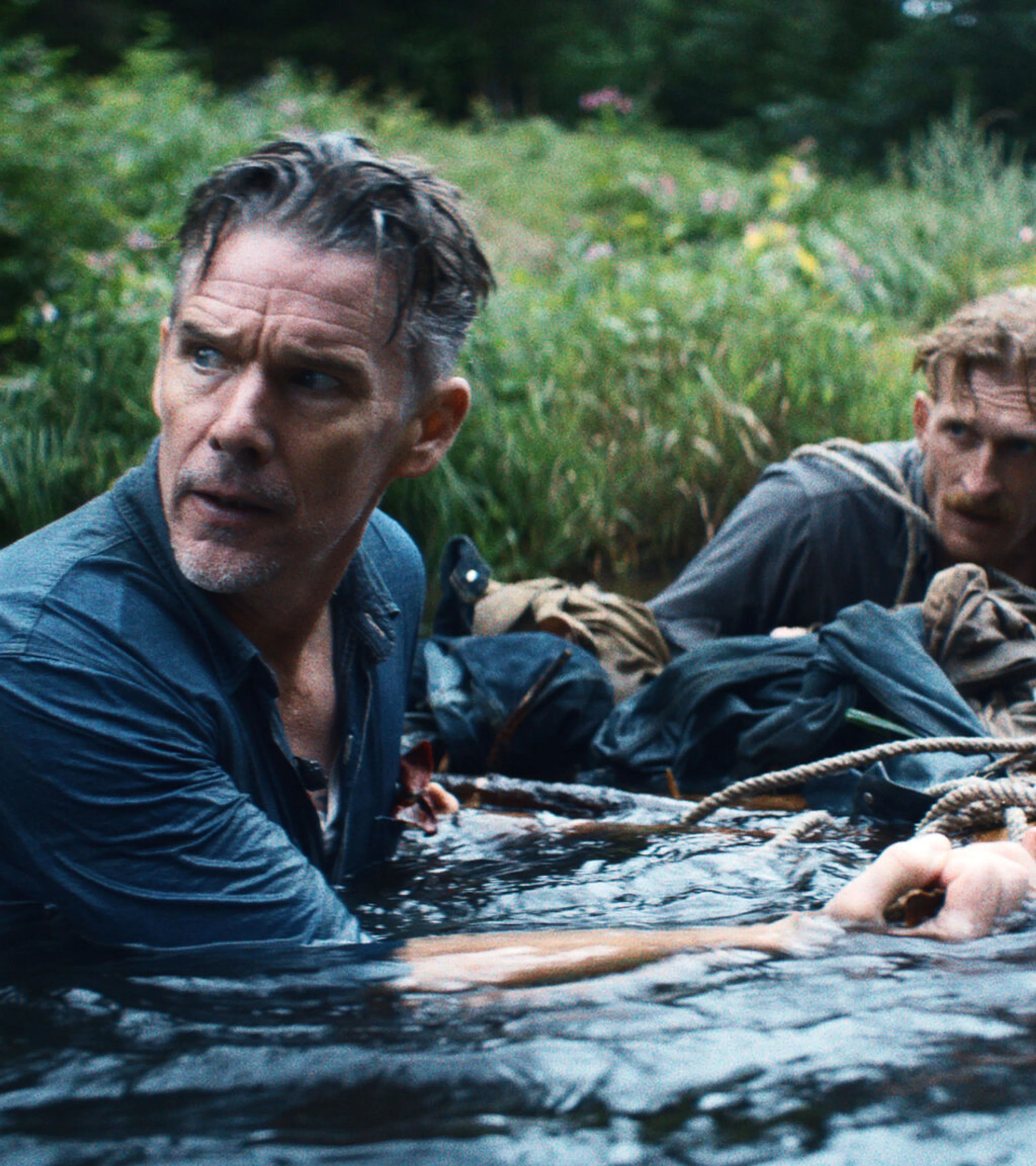 Ethan Hawke looks across a river in a scene from The Weight.