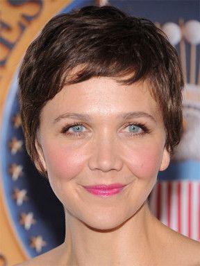 Portrait of Maggie Gyllenhaal with short brown hair.
