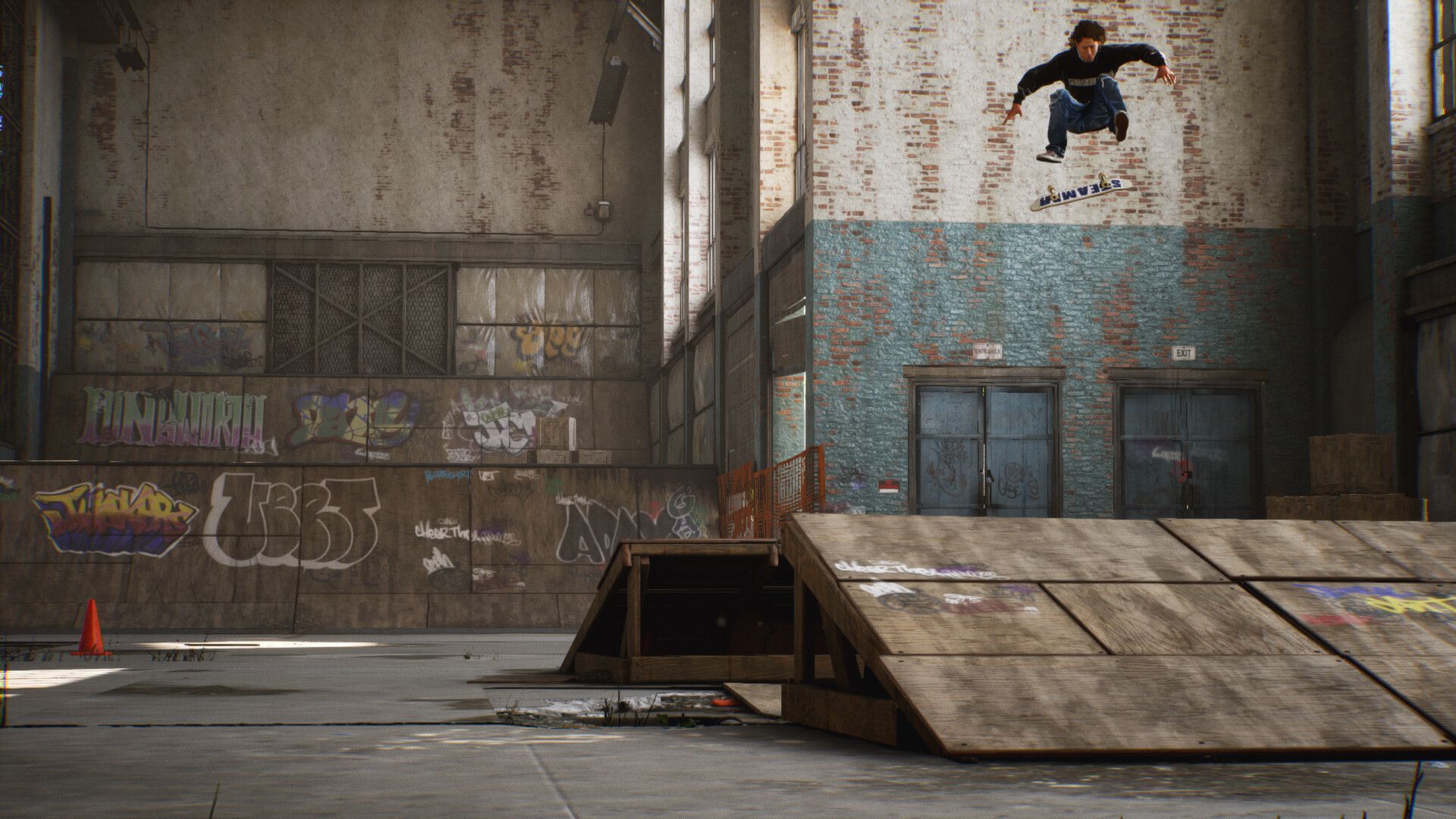 A skater rises above a warehouse ramp and abandoned car, showing another route through an indoor skatepark.
