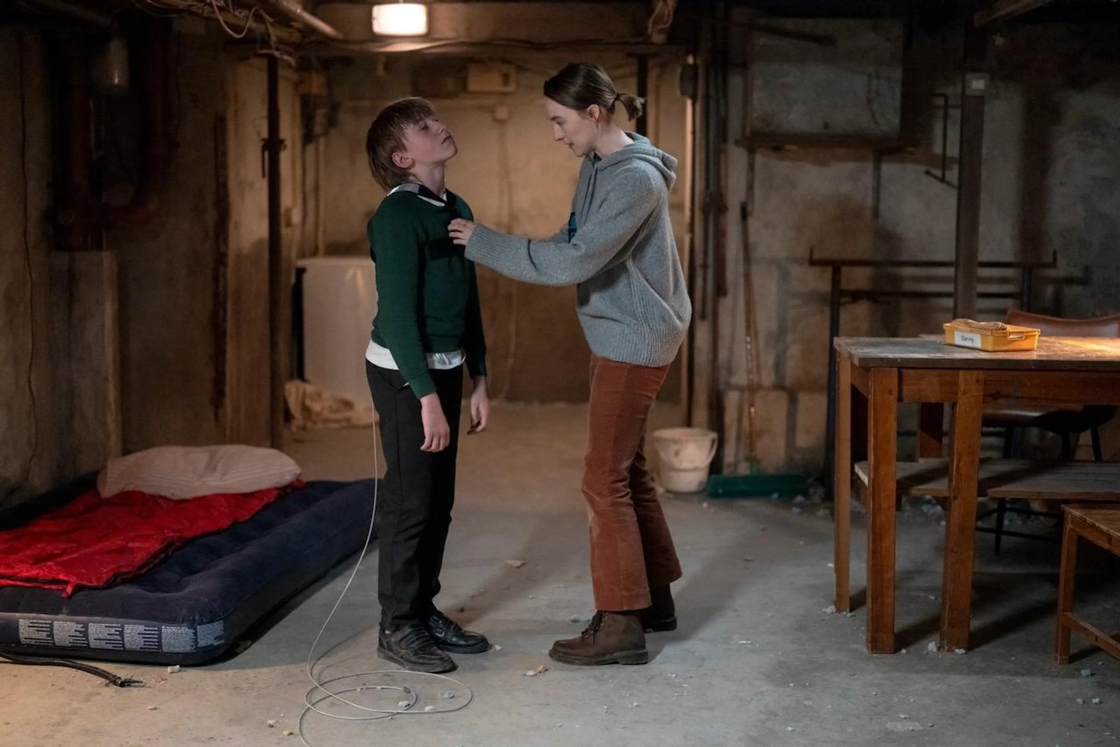 Saoirse Ronan and Eddie Waller appear in a tense scene from Bad Apples.