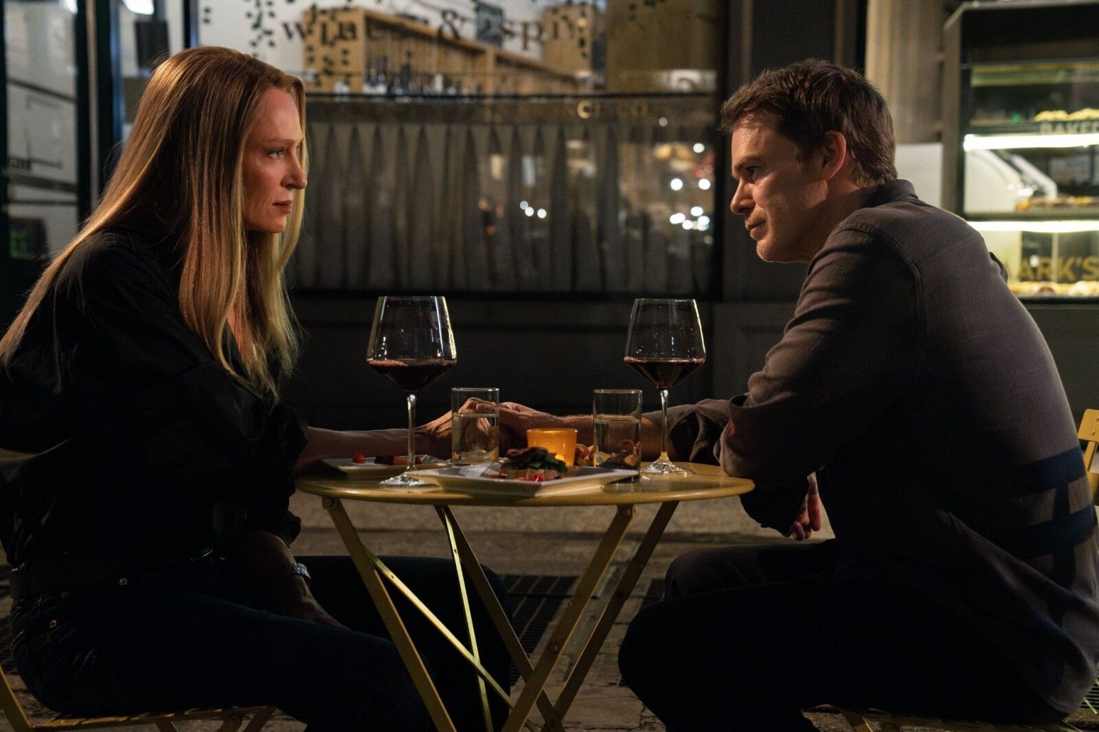 Uma Thurman as Charley sits across a table from Michael C. Hall as Dexter Morgan in a Season 2 first-look still.