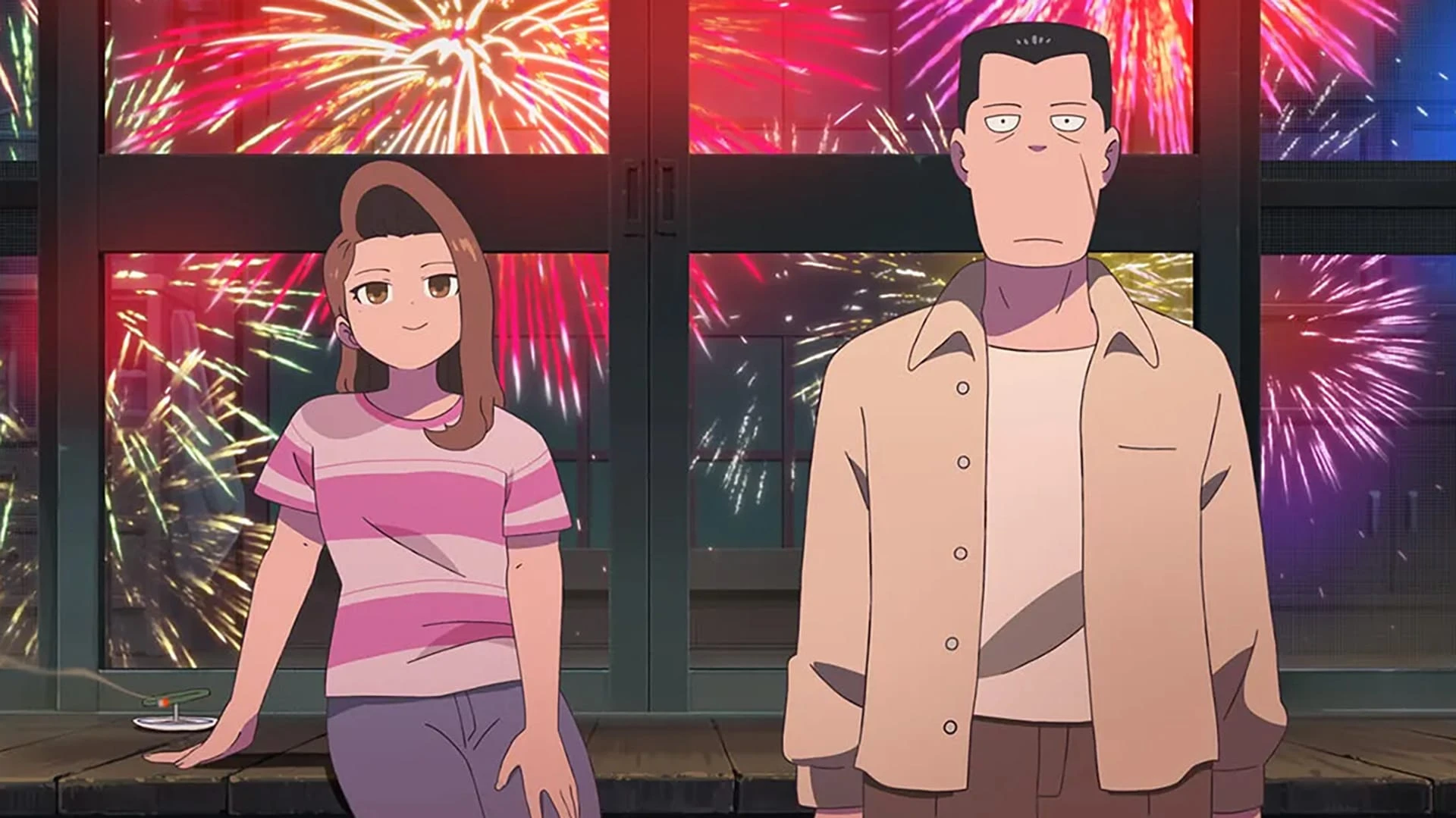 Nana and Akutsu at home, with fireworks visible through the windows behind them.