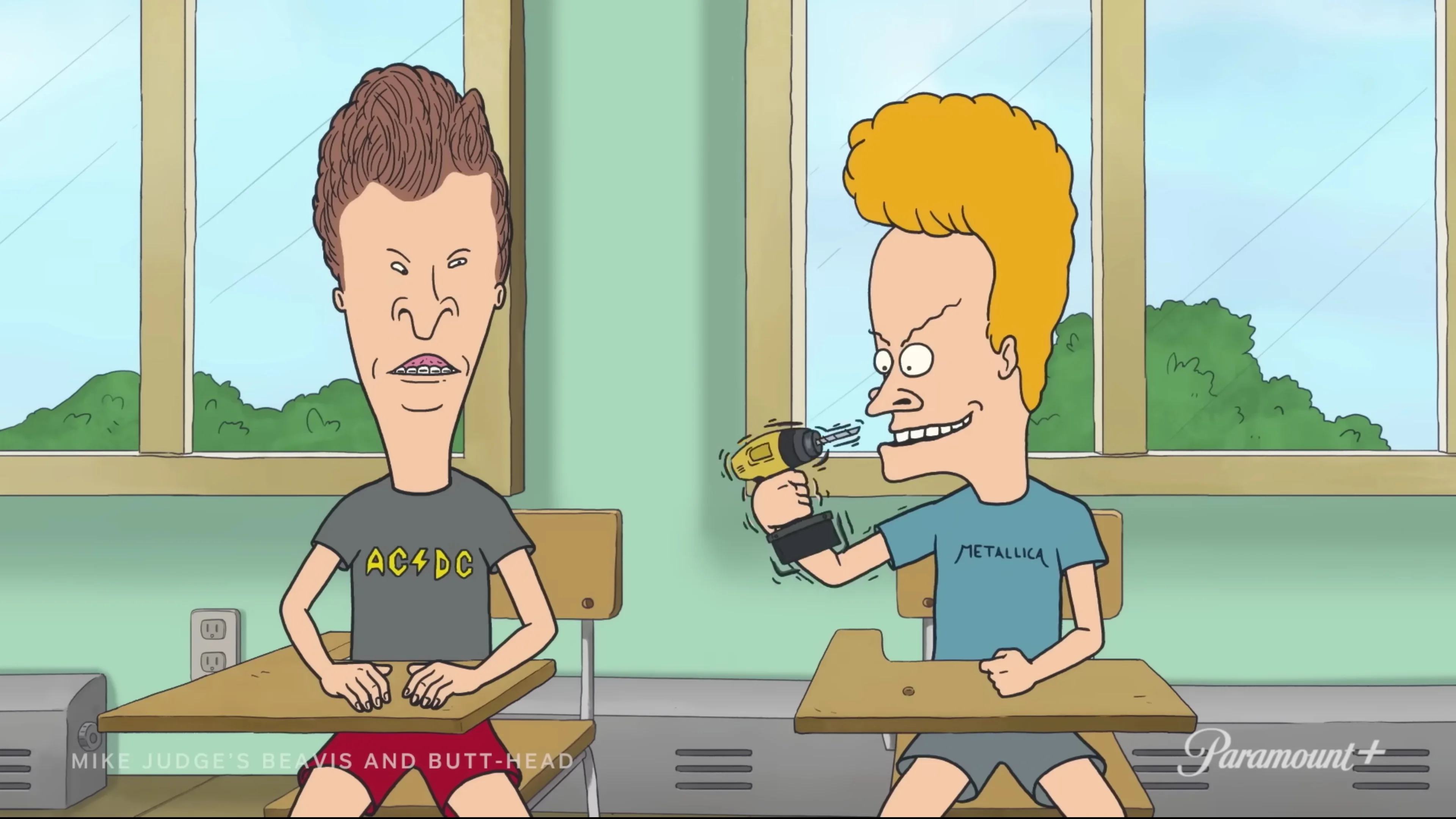 Beavis and Butt-Head sit in a classroom in an official promotional still.