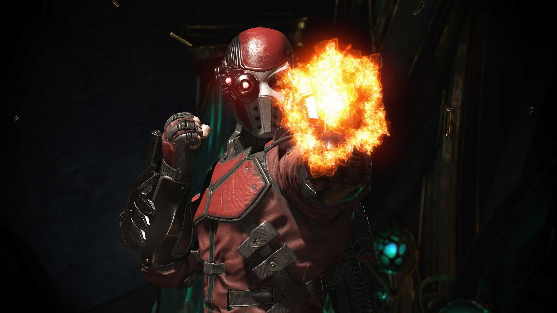 Deadshot fires a wrist-mounted gun while wearing a red helmet and armored suit.