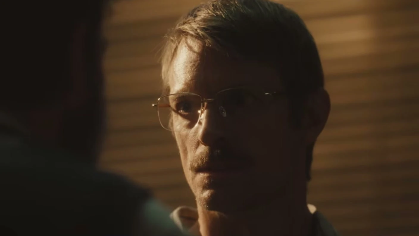 Joel Kinnaman as CIA analyst John Nixon looks ahead in a dim scene from High Value Target.