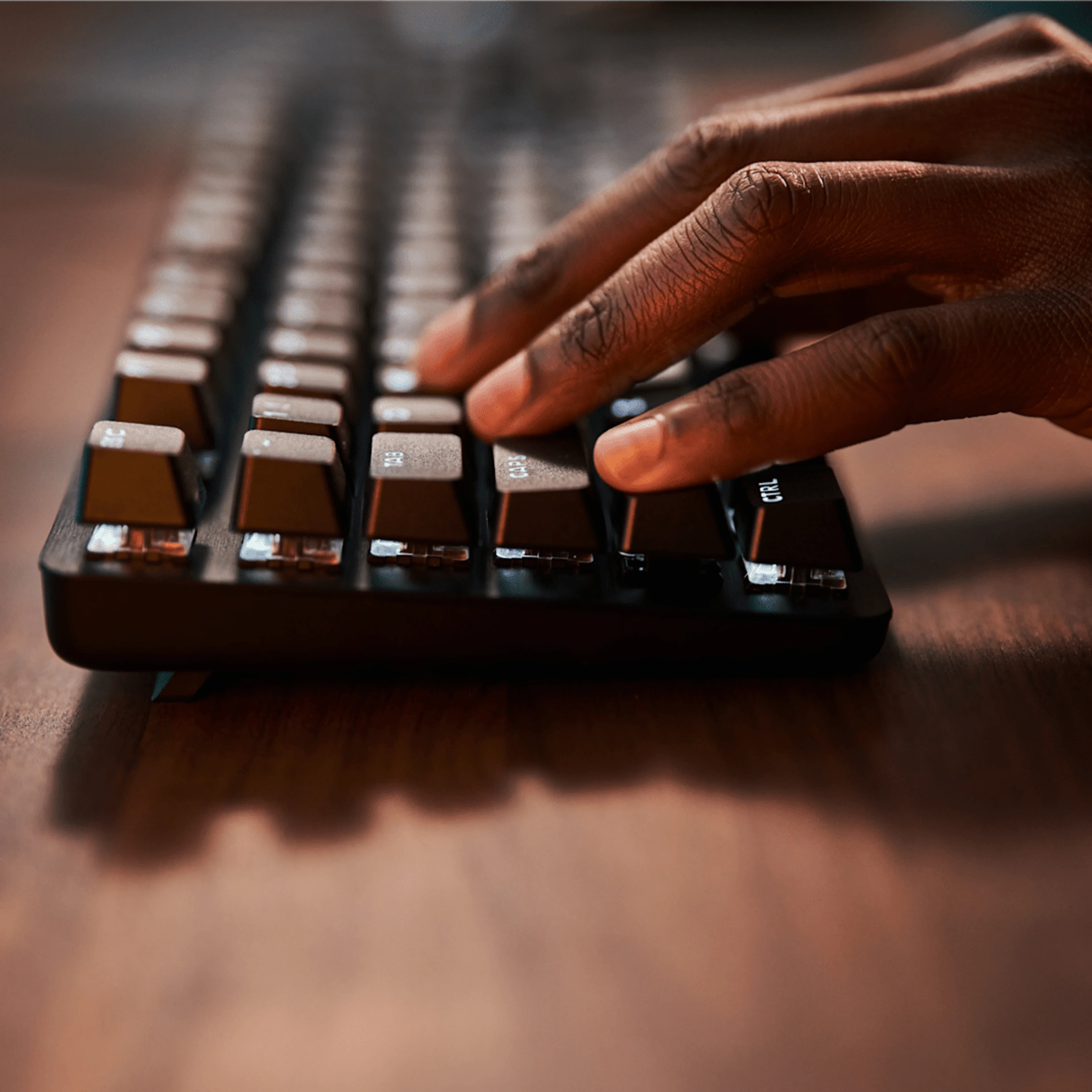 Close view of a hand using the Logitech G413 TKL SE keys