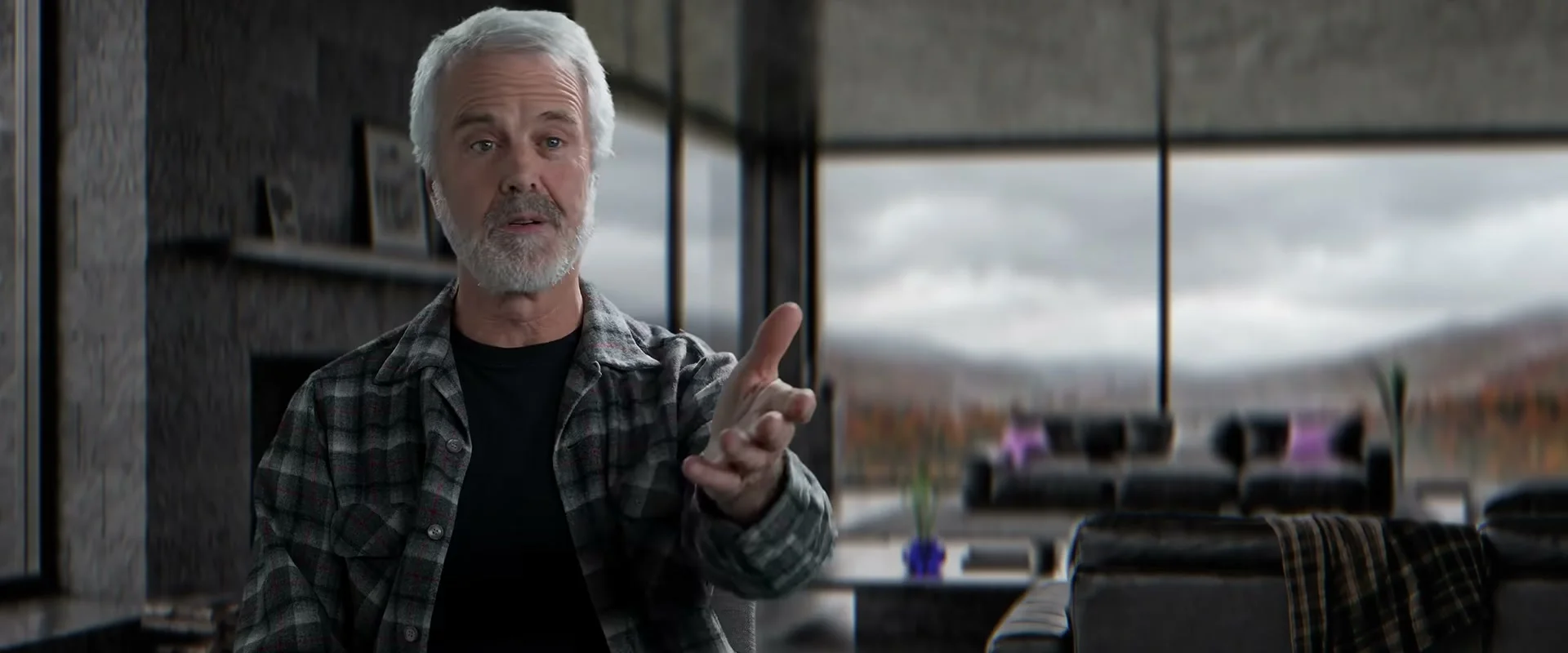 A gray-haired interview subject speaks directly to camera in the official Musk documentary trailer.