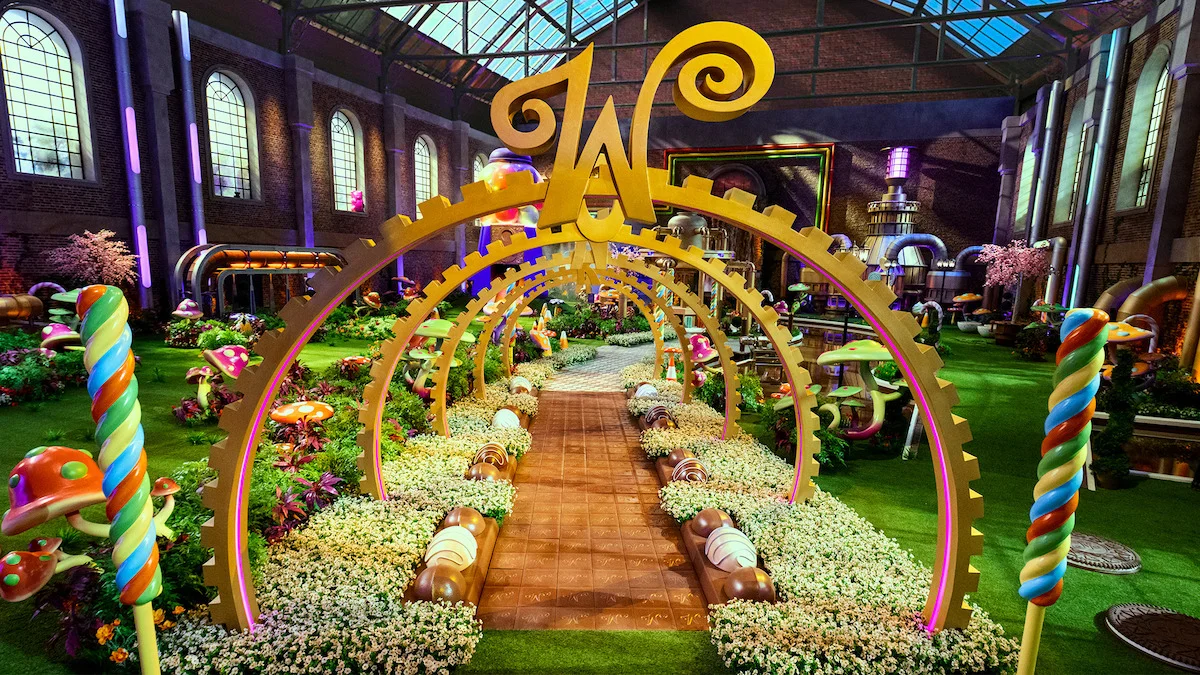 A candy-filled walkway leads into the recreated Chocolate Factory for Wonka’s The Golden Ticket.