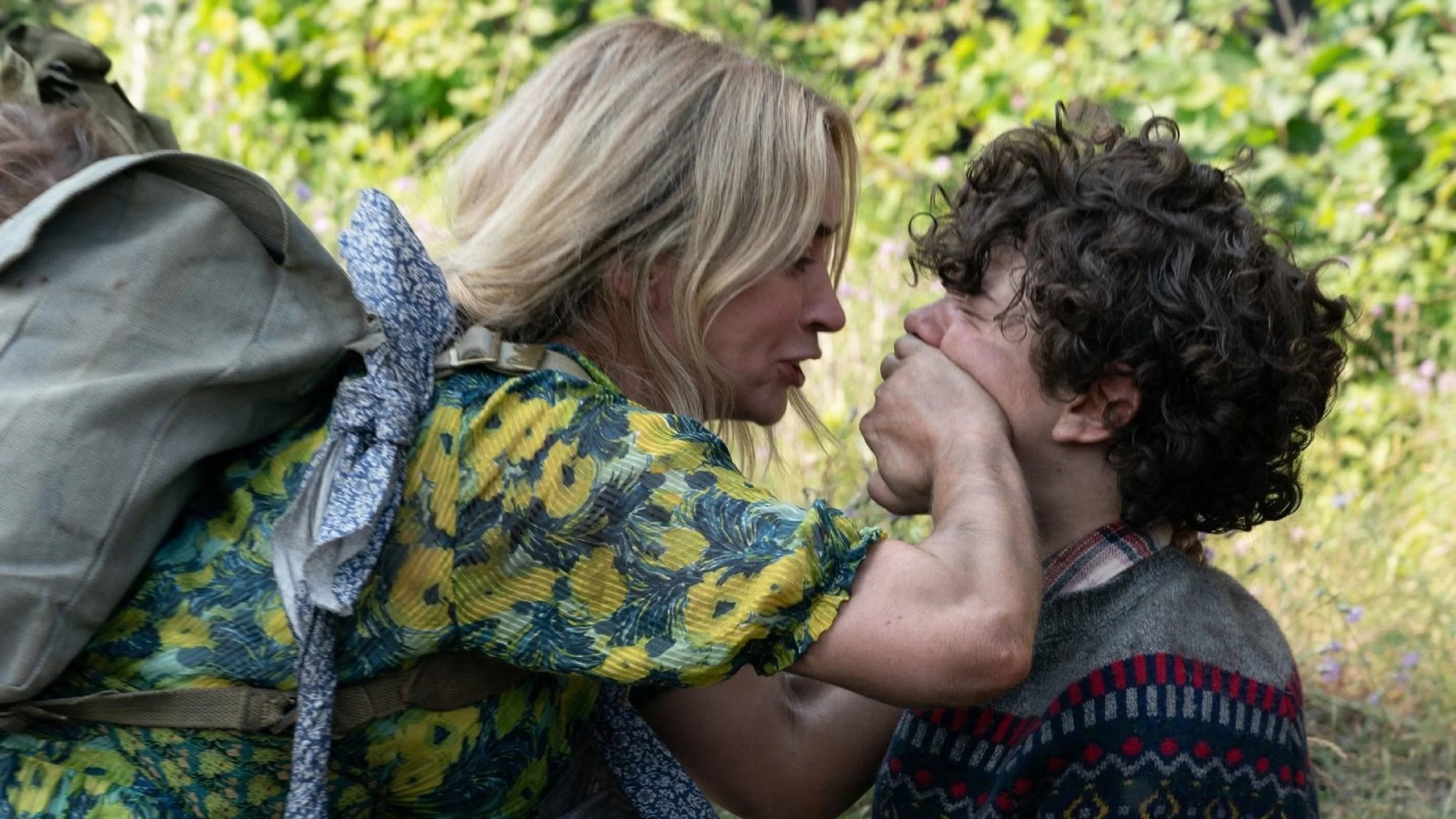 Noah Jupe appears with Emily Blunt in an official still from A Quiet Place.