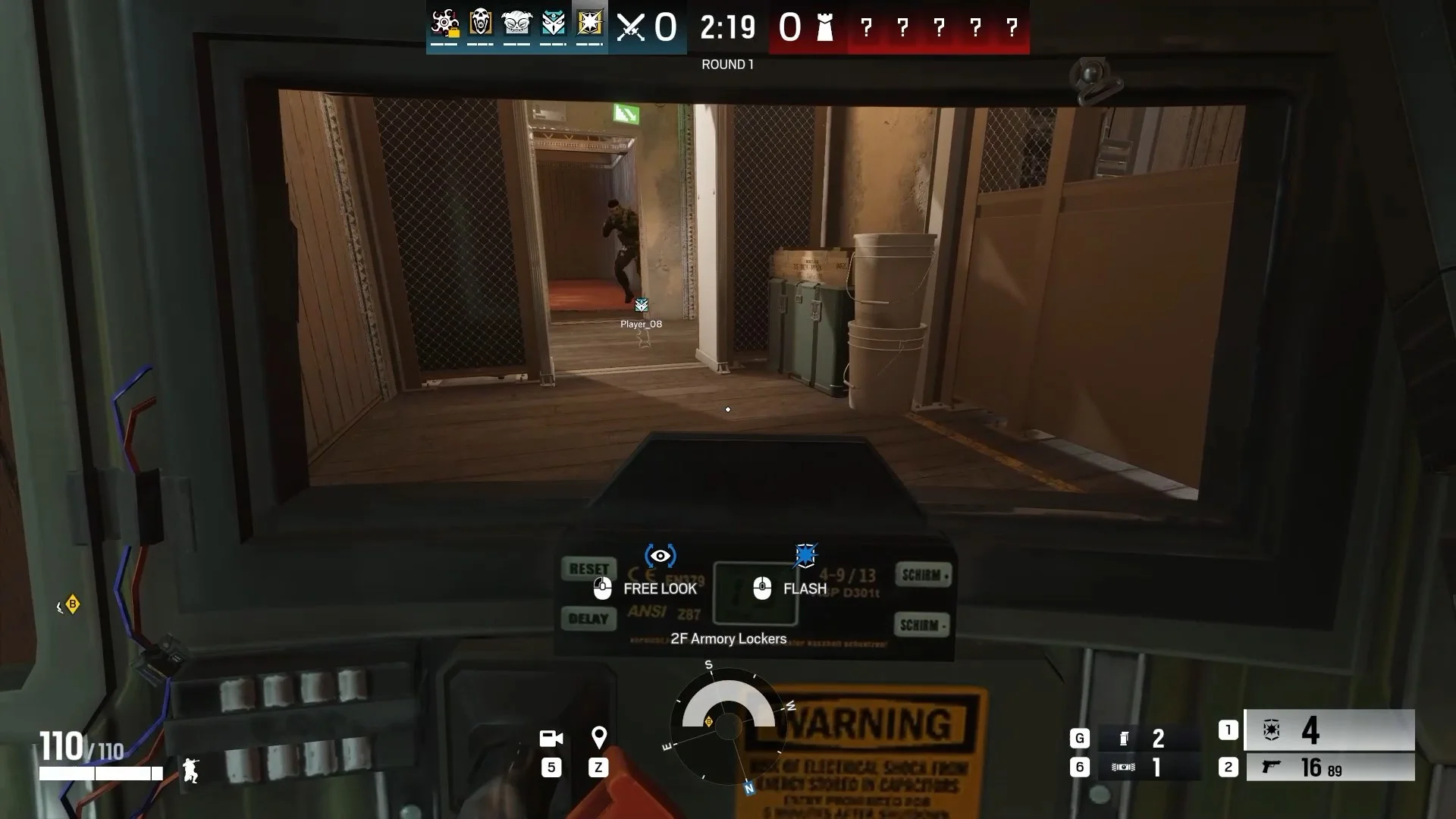 An official Rainbow Six Siege gameplay frame shows a first-person view through tactical equipment toward an enemy in a doorway.