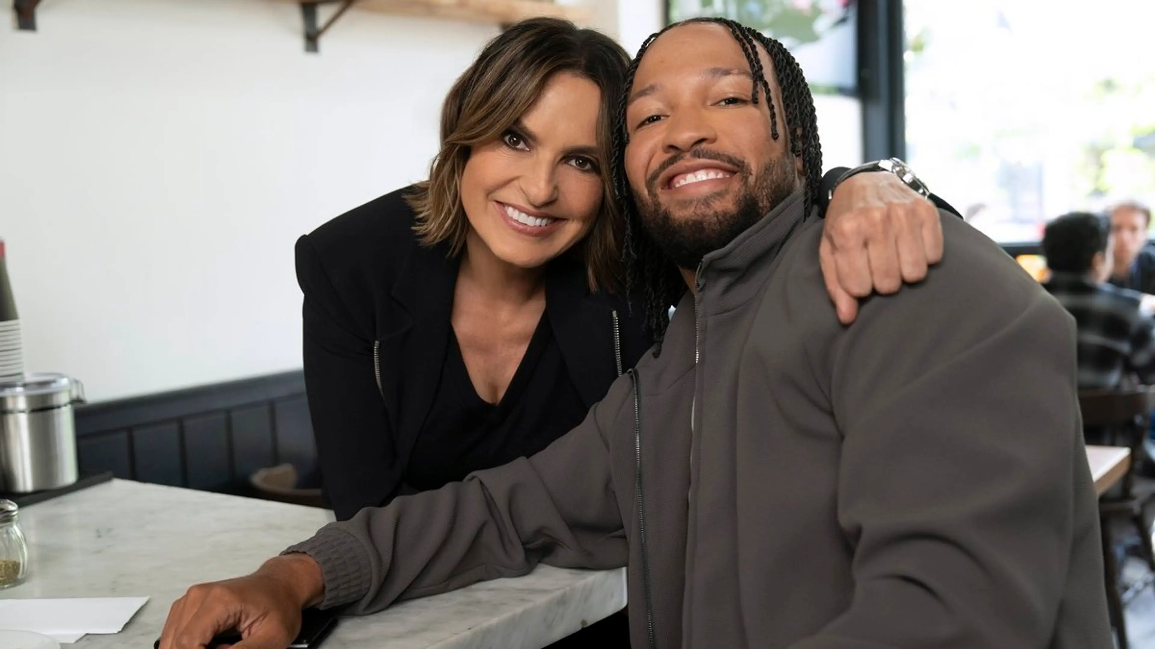 Mariska Hargitay smiles beside Jalen Brunson on the Law & Order: SVU set.