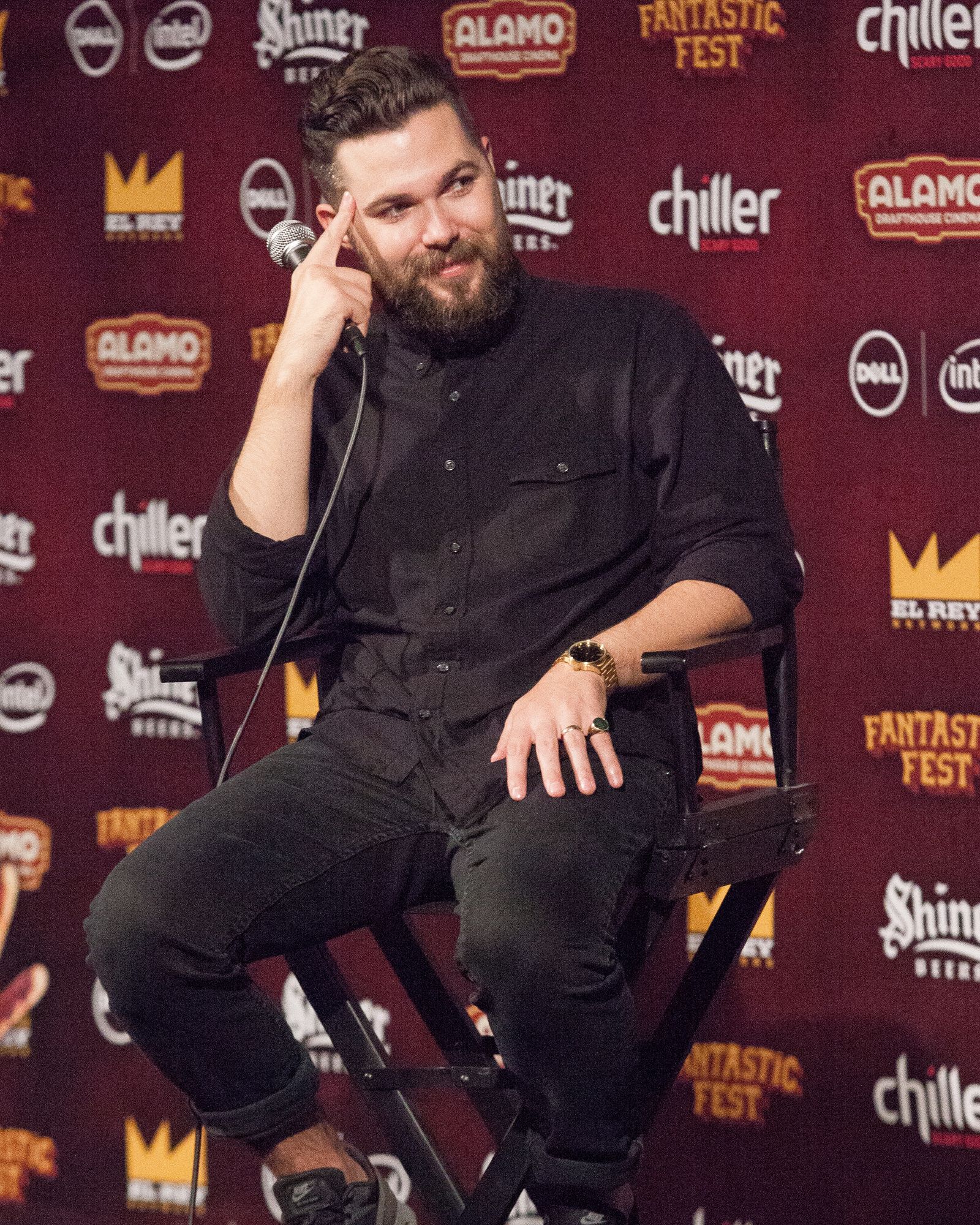 Robert Eggers sits onstage with a microphone at Fantastic Fest.