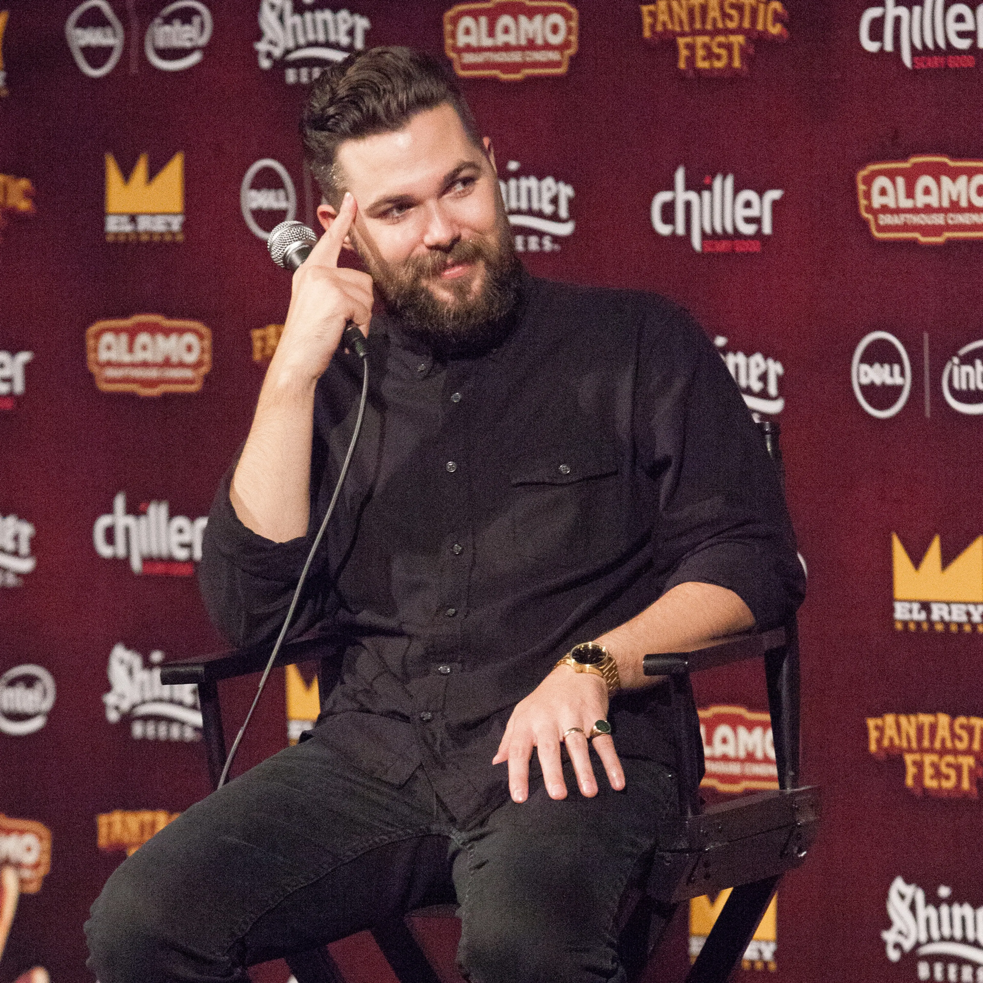 Robert Eggers sits onstage with a microphone at Fantastic Fest.