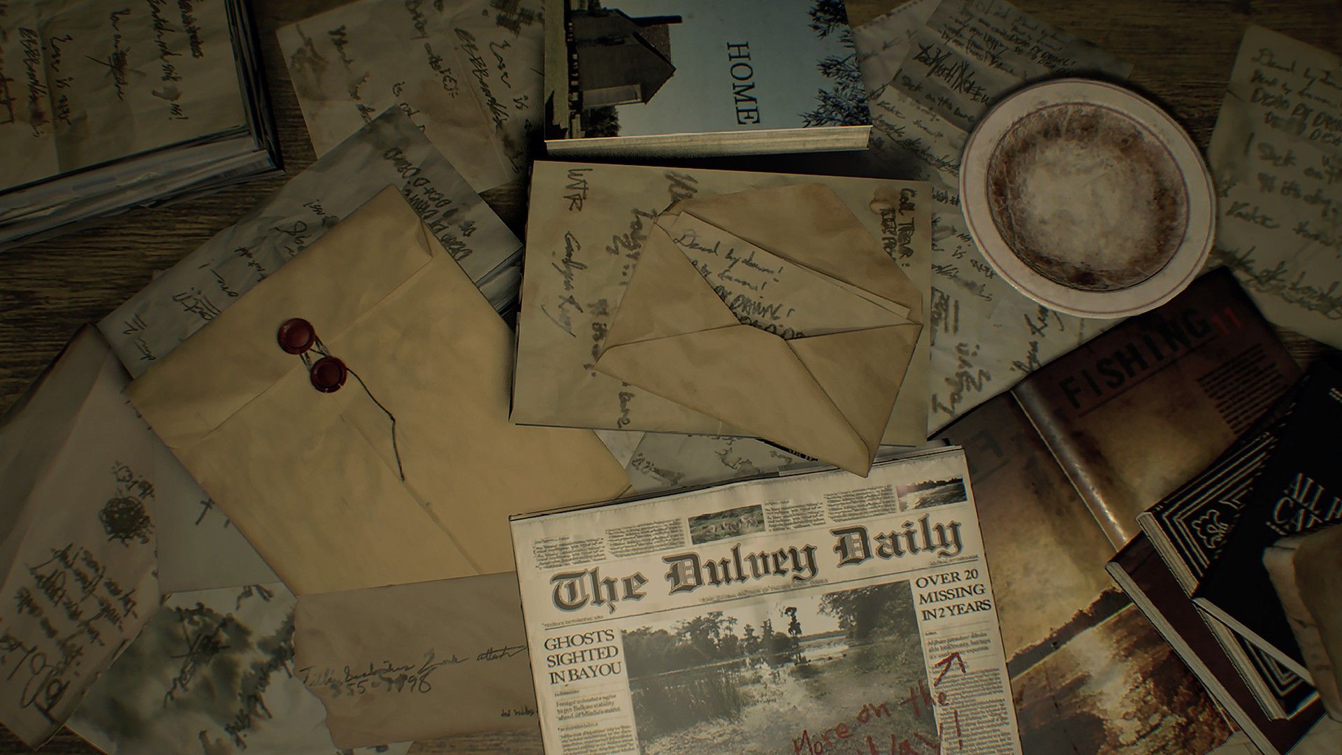 Papers, a map and a newspaper lie across a desk.