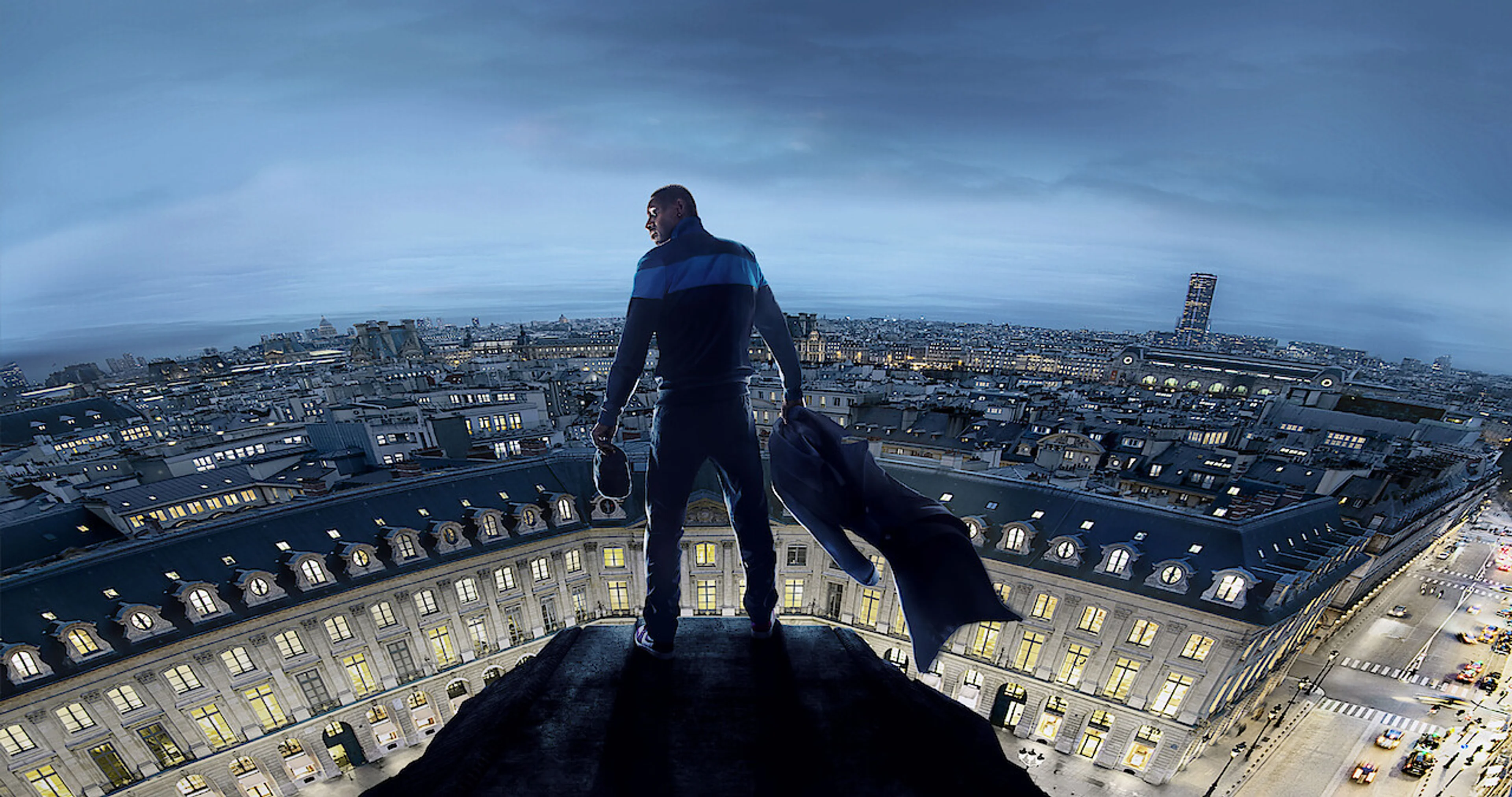 Omar Sy looks out across Paris from a high rooftop in Lupin Part 3.