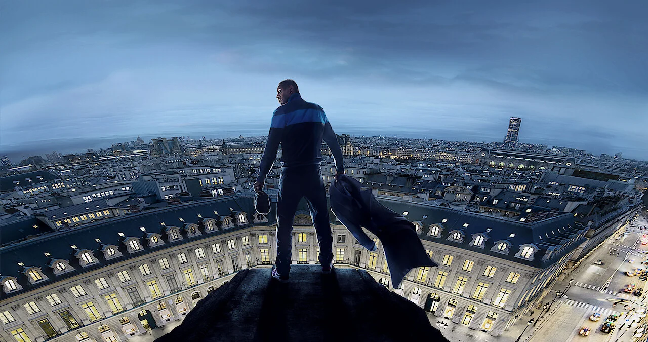 Omar Sy looks out across Paris from a high rooftop in Lupin Part 3.