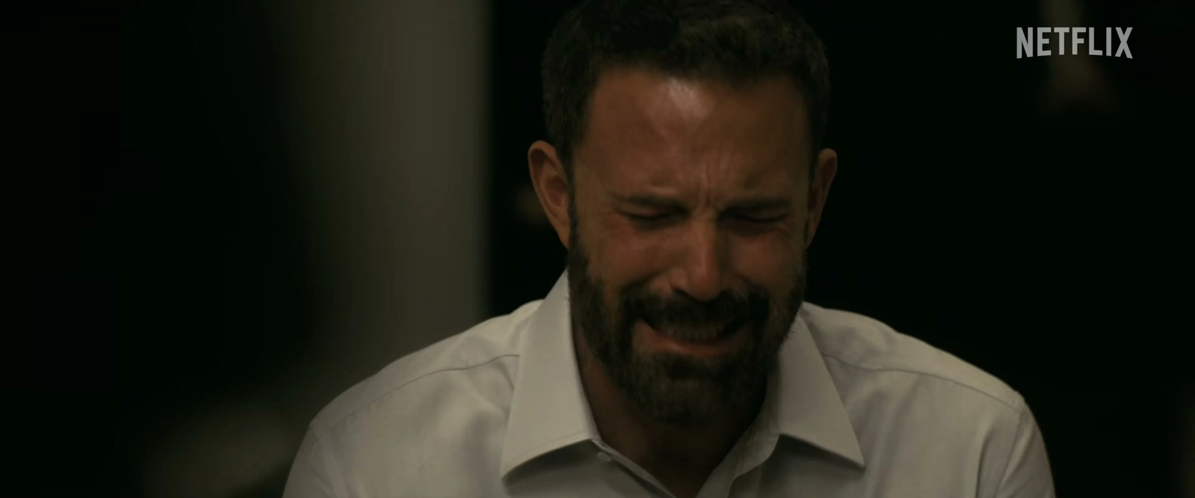 Ben Affleck as Mark Kimball sits alone and cries in Animals.