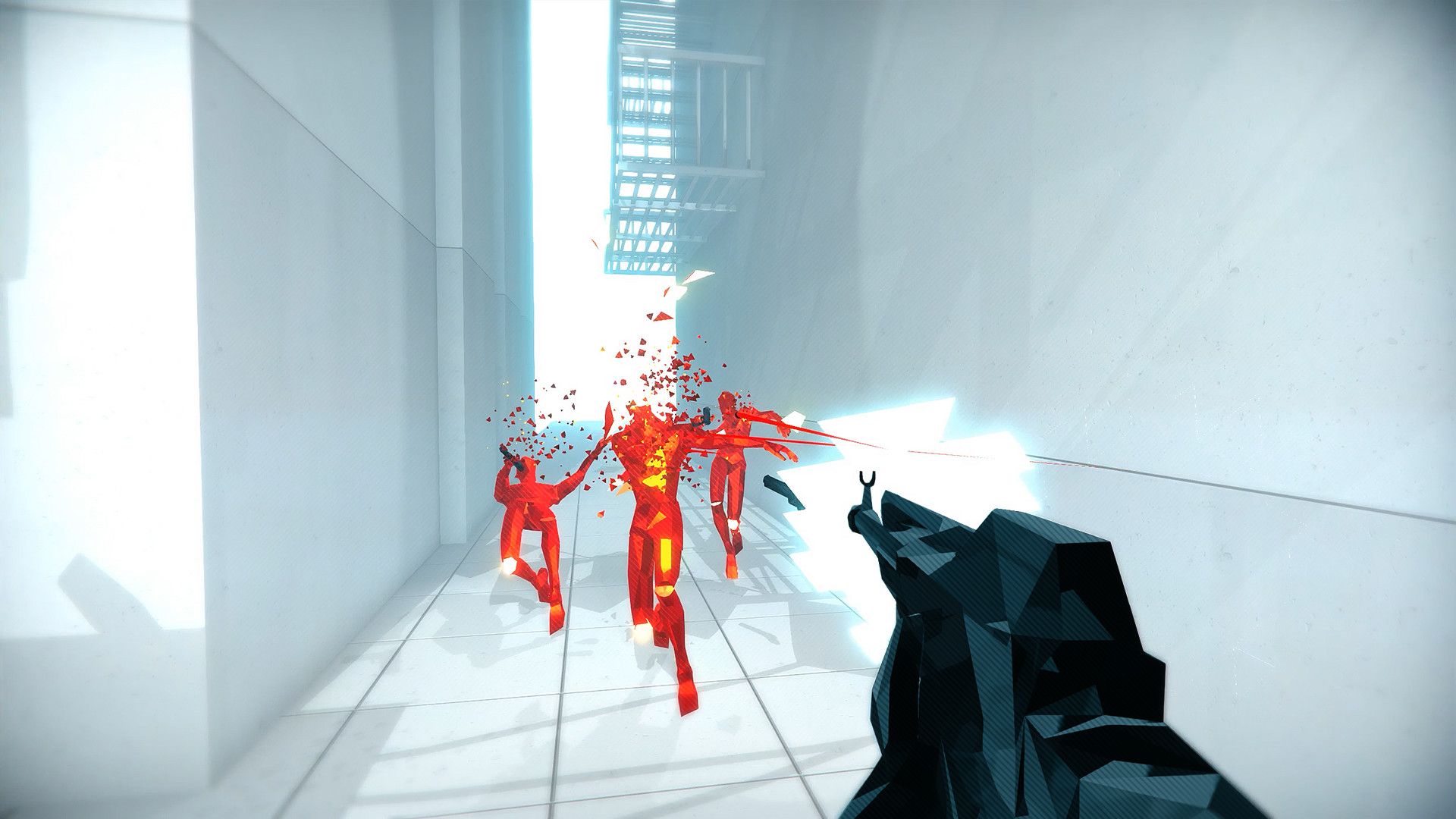 A player aims a black gun down a bright corridor at several red enemies.