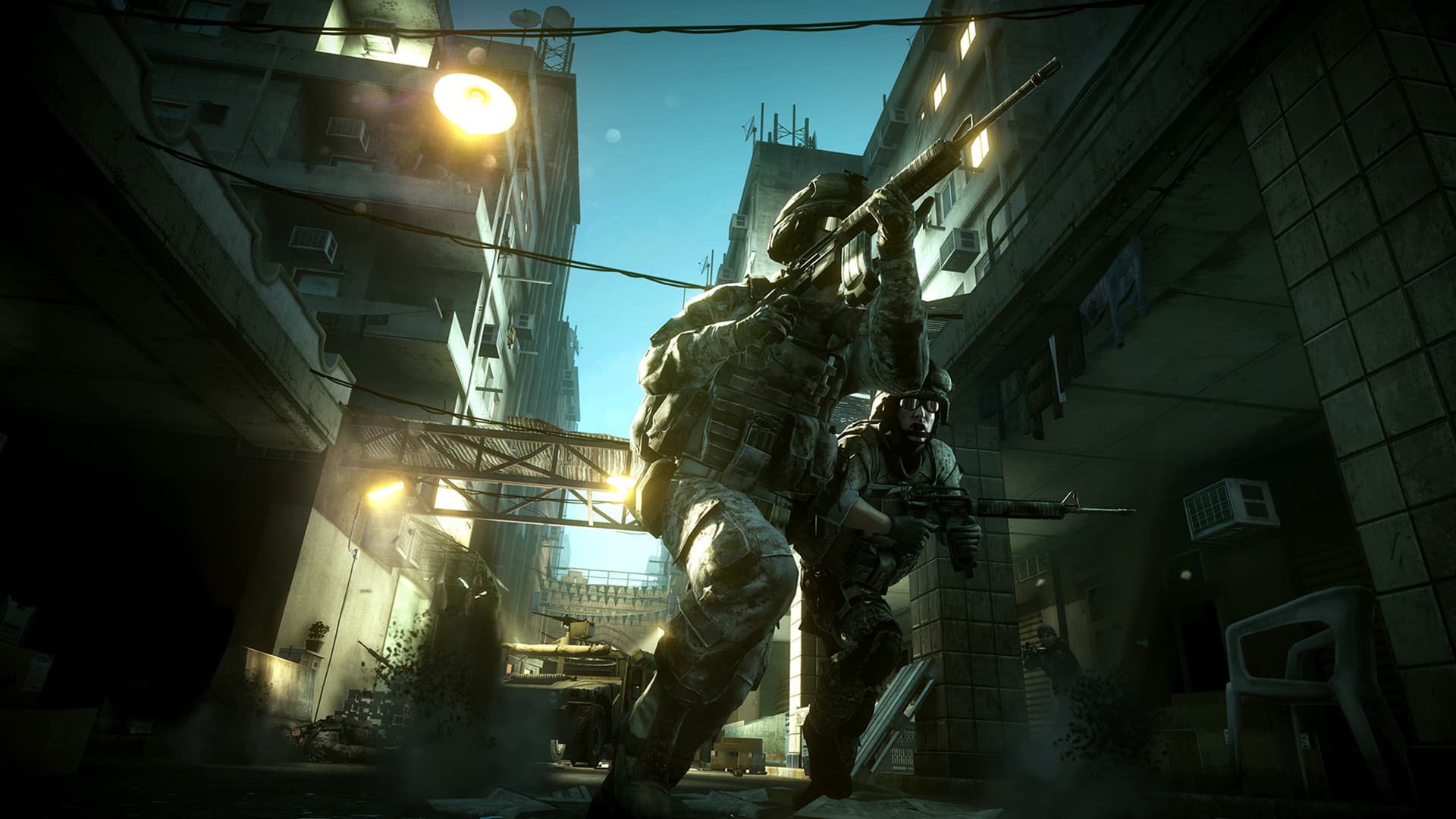 Armed soldiers walk through a narrow city alley with overhead wires.