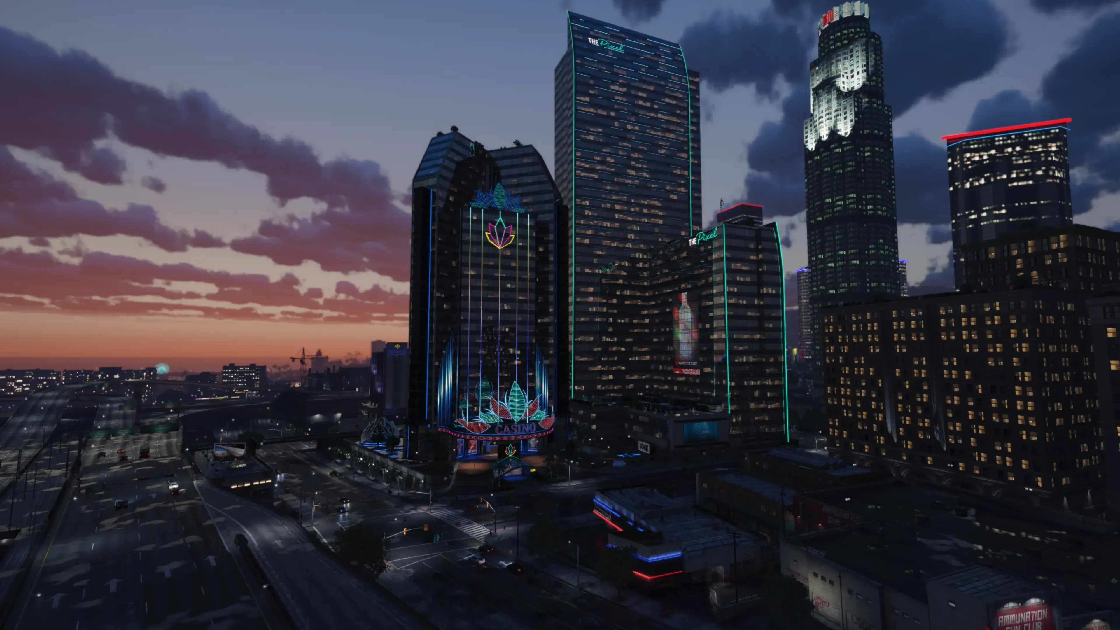 The illuminated Pixel Tower and casino rise over the NoPixel V Pixel Area at sunset.