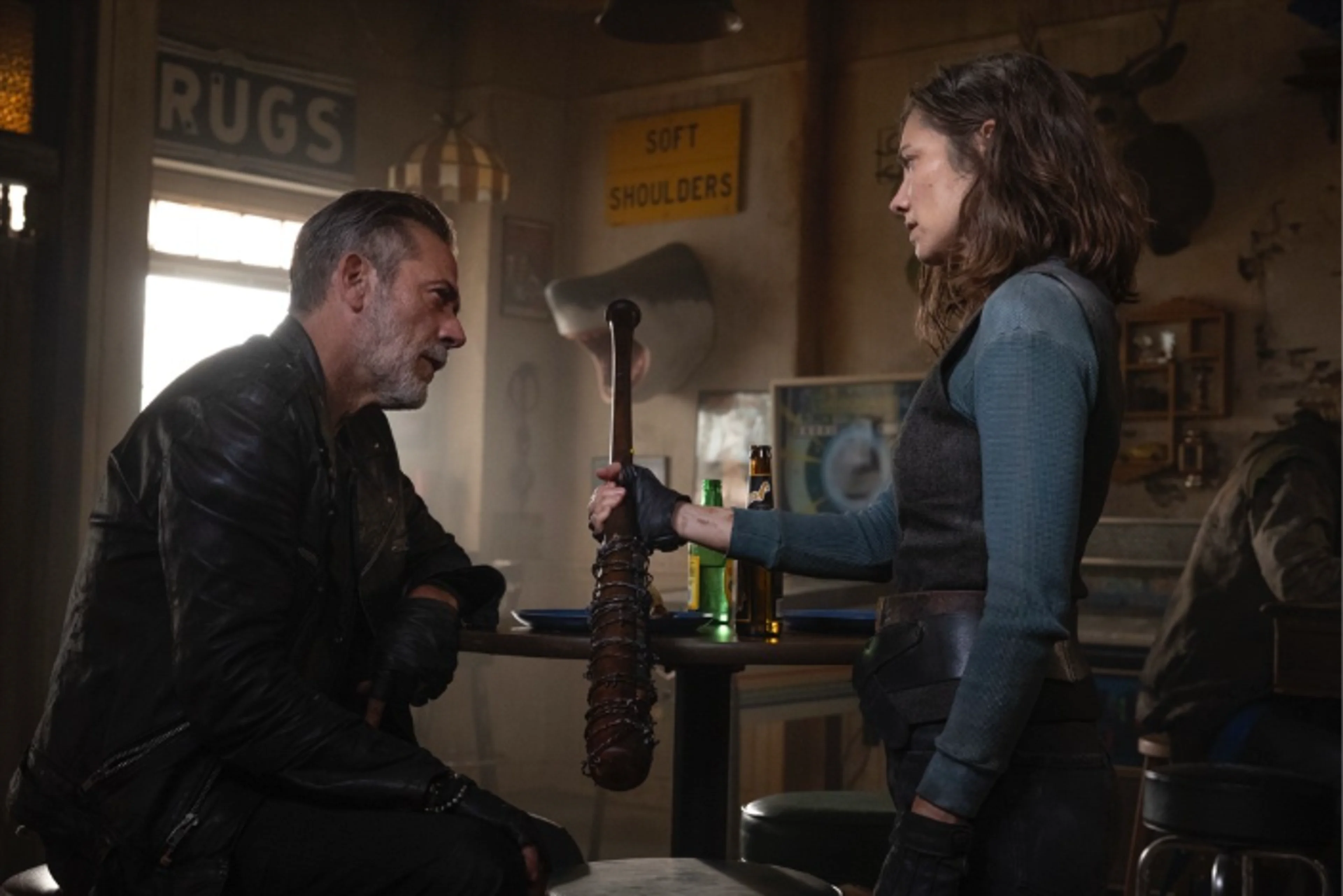 Maggie and Negan move through an interior location in an official Dead City Season 3 still.