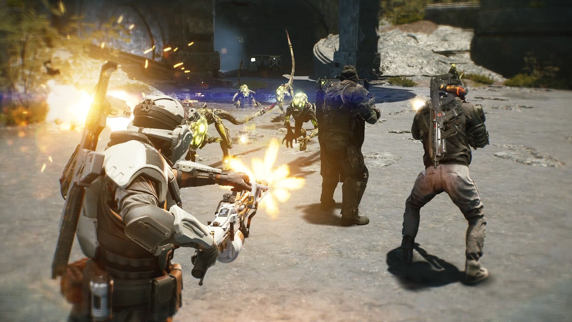 A squad fires at approaching creatures among stone ruins in Aliens: Fireteam Elite.