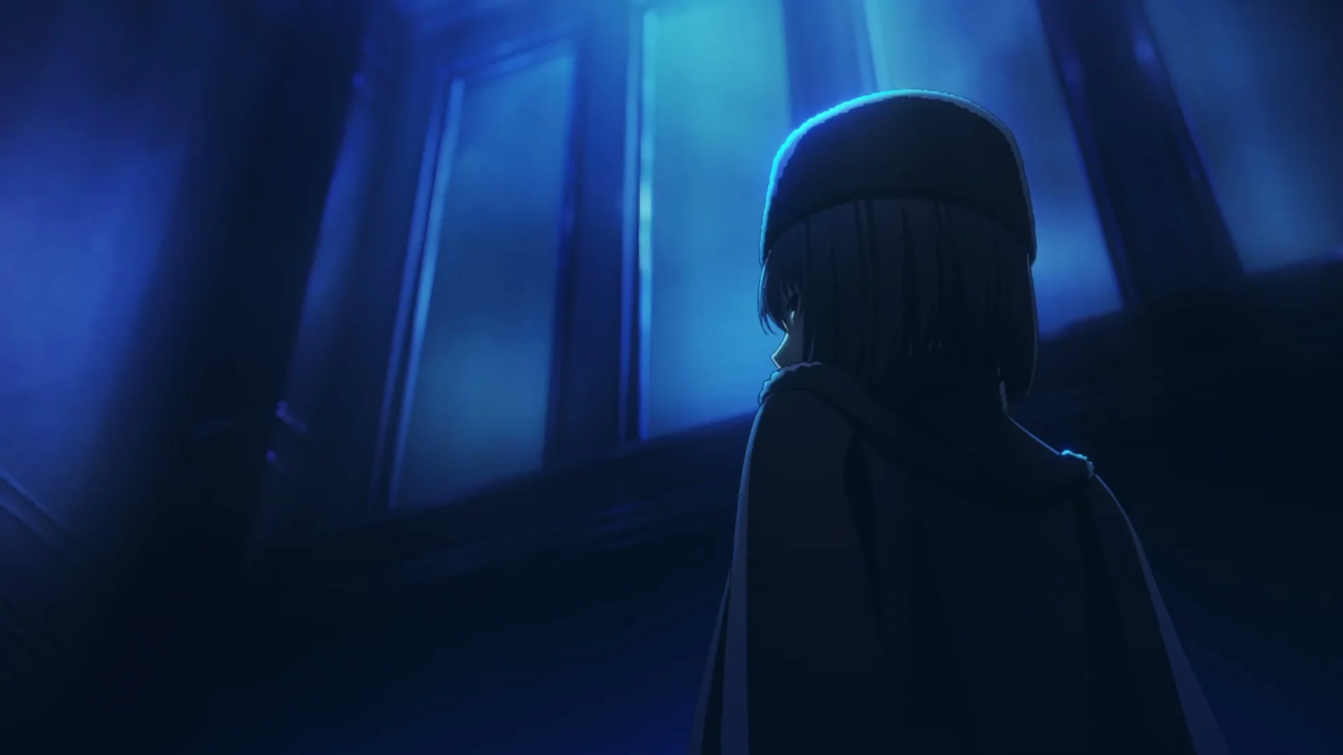 A girl in a dark hat and coat stands beside a blue-lit window.