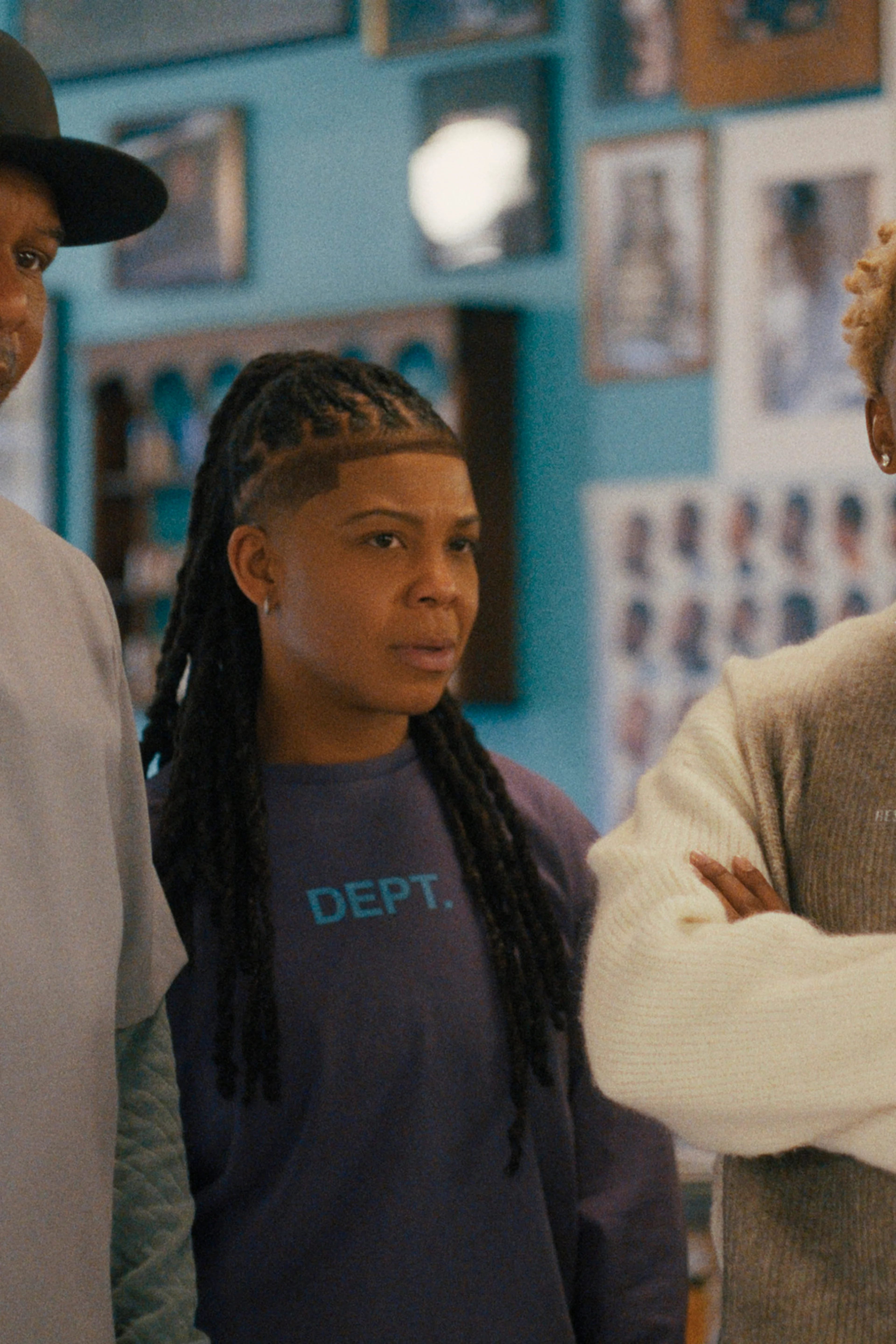 Roy Wood Jr., Punkie Johnson, Brett Gray and E.J. Bonilla stand together inside the barbershop.