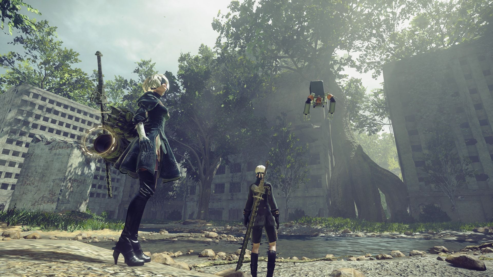 2B and 9S stand near a small machine in an overgrown urban area.