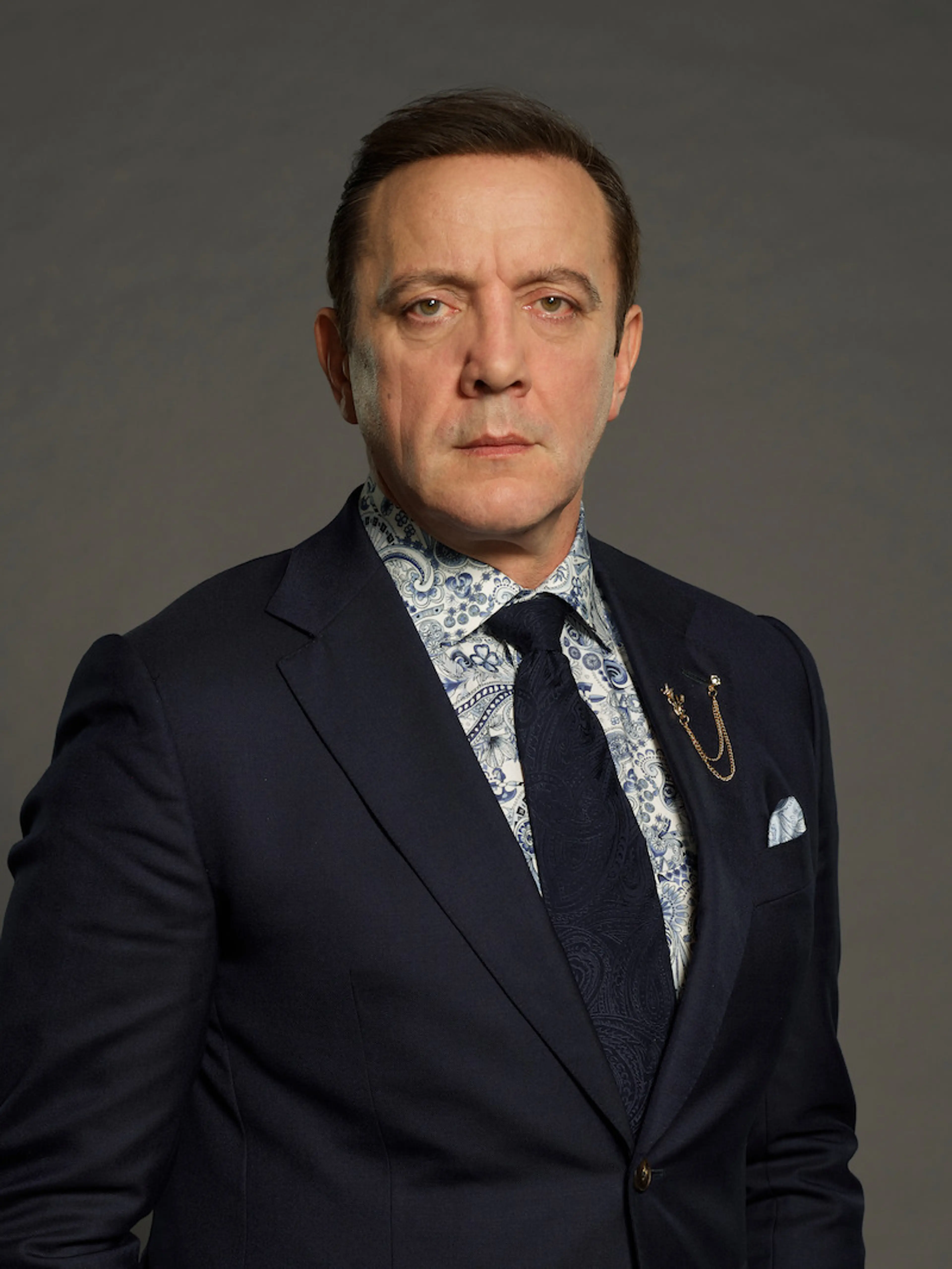 Peter Serafinowicz poses in a dark suit for Celebrity Million Dollar Secret.