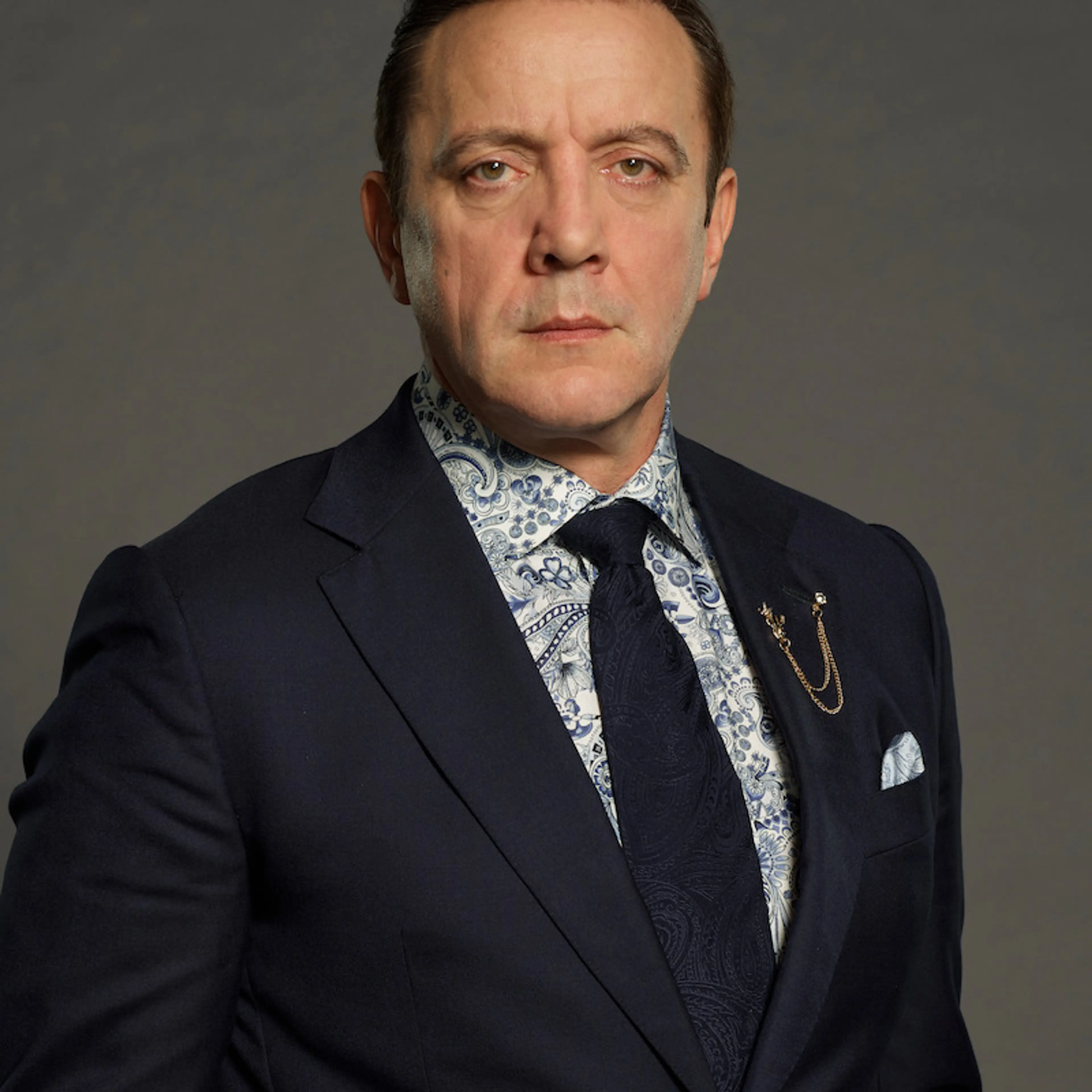 Peter Serafinowicz poses in a dark suit for Celebrity Million Dollar Secret.